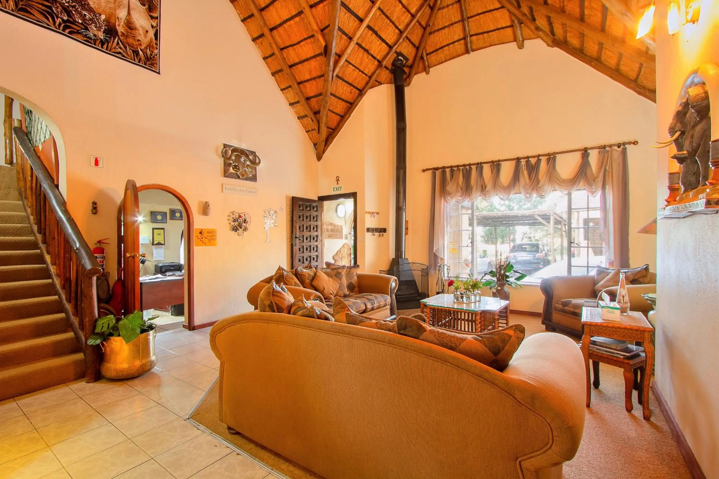 Communal lounge/ TV room in All over Africa Guest house
