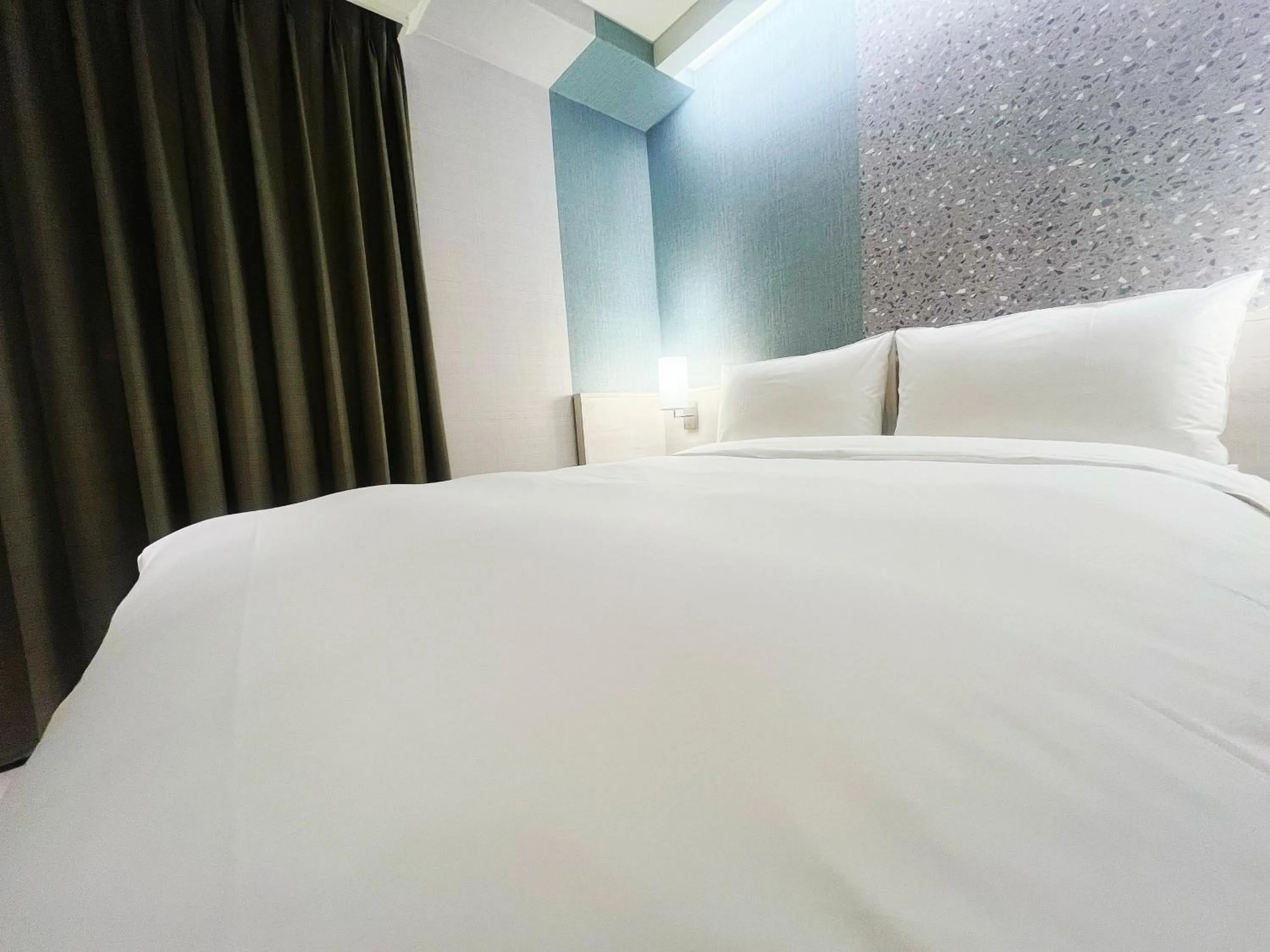 Bed in 新仕飯店-New City Hotel