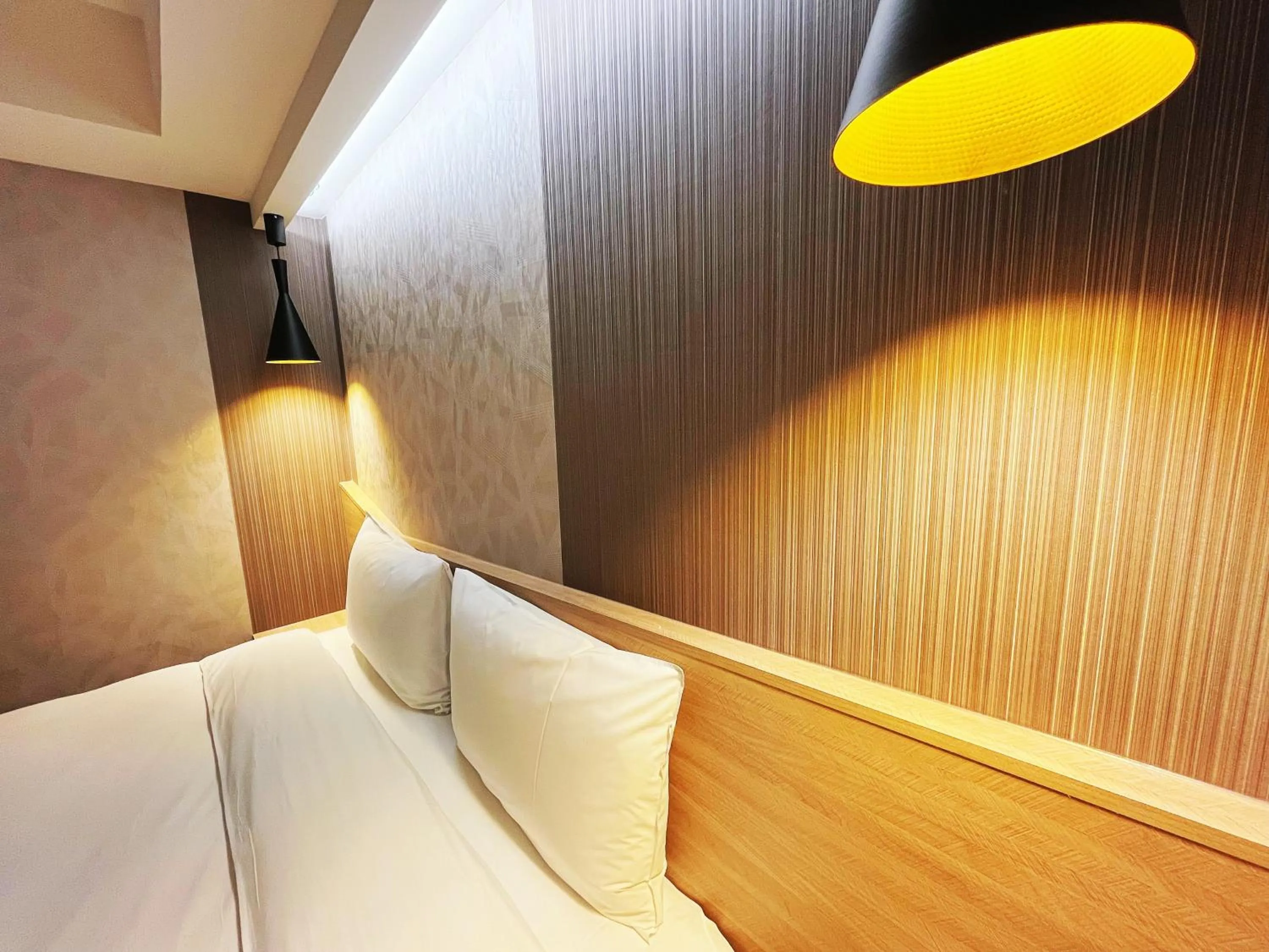 Bed in 新仕飯店-New City Hotel