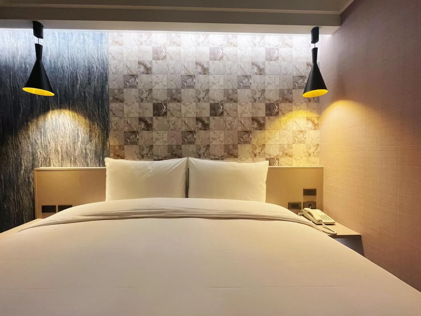 Bed in 新仕飯店-New City Hotel