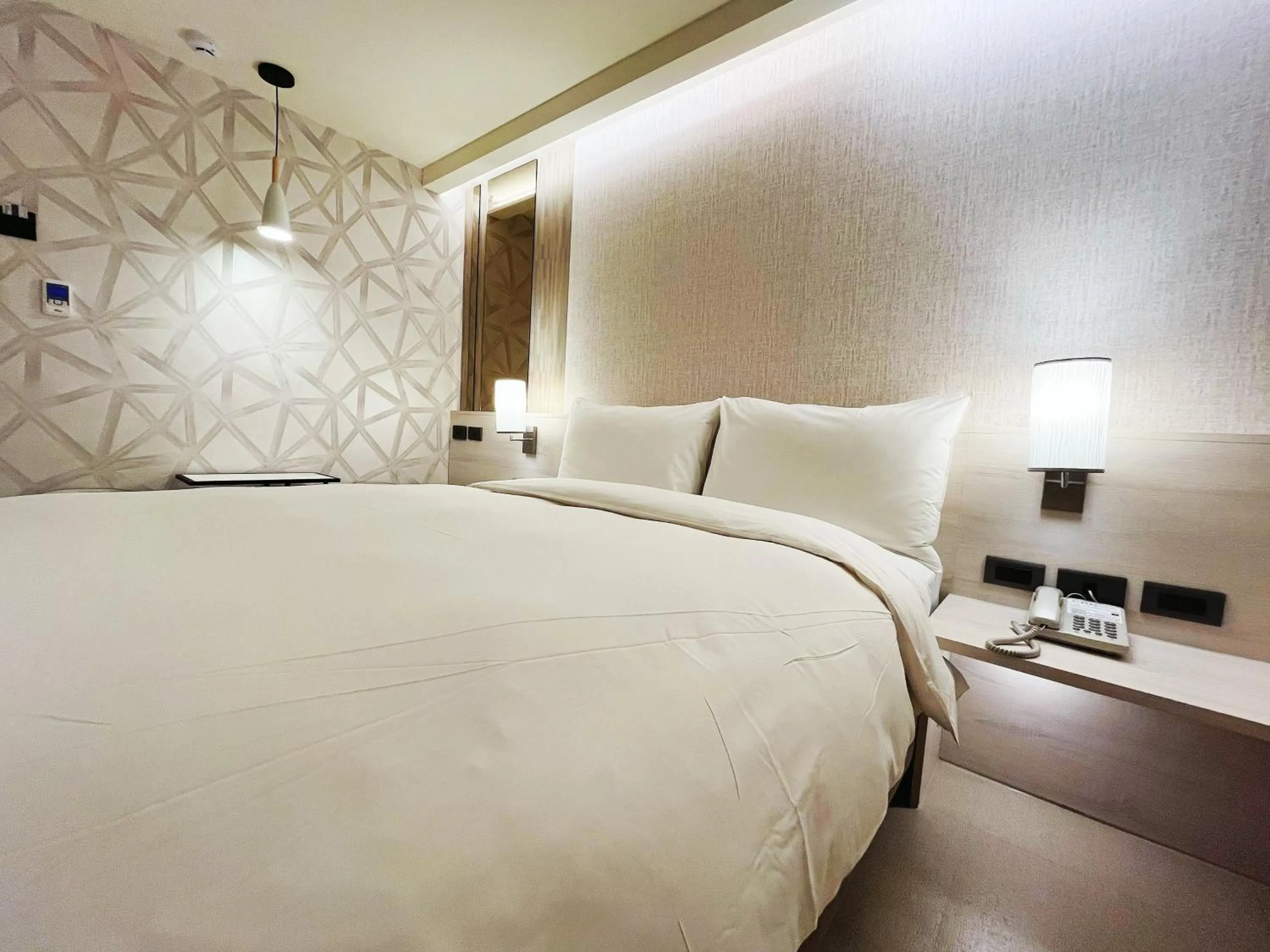 Bed in 新仕飯店-New City Hotel