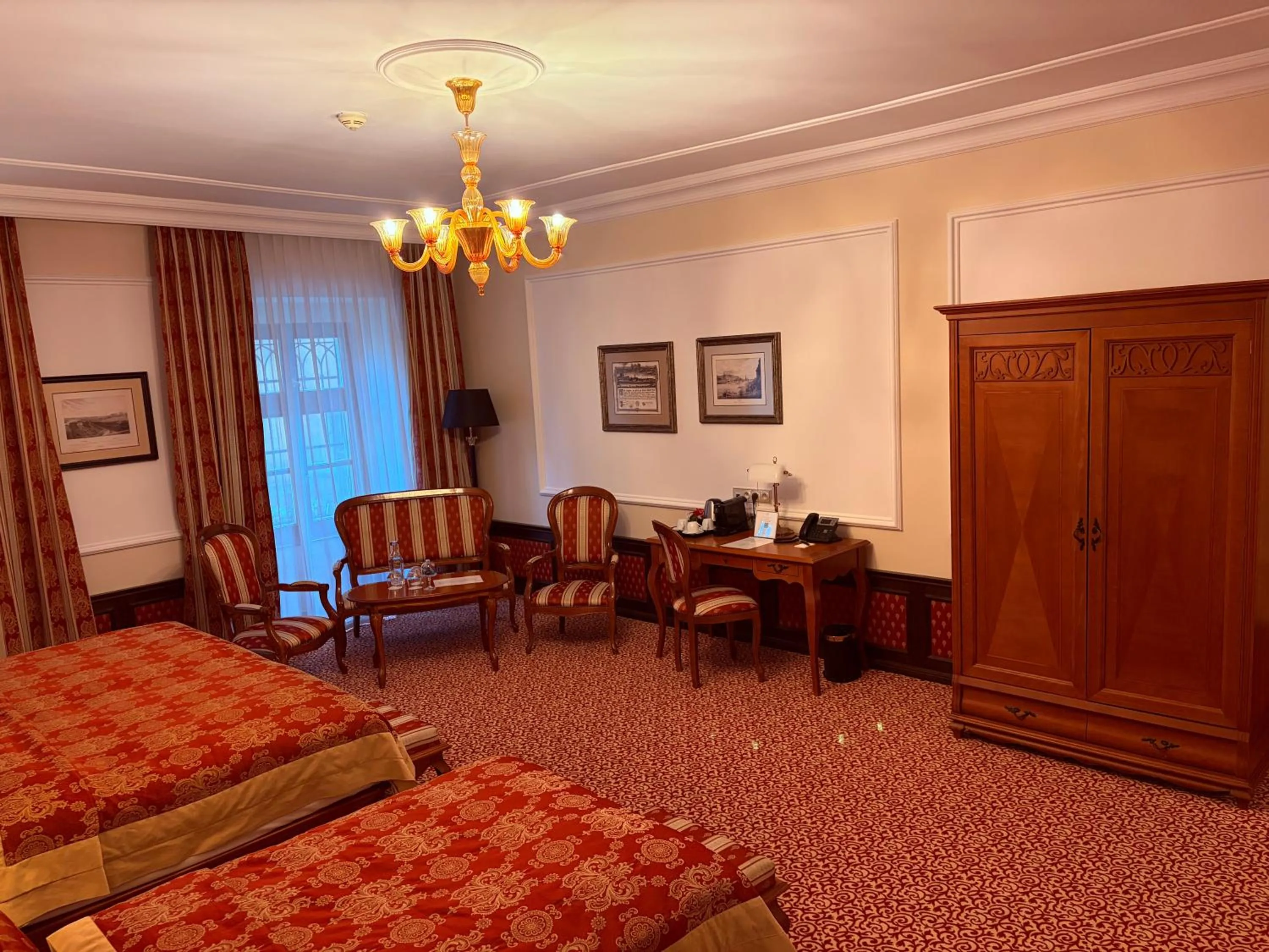 Seating area, Bed in Arcadia Boutique Hotel