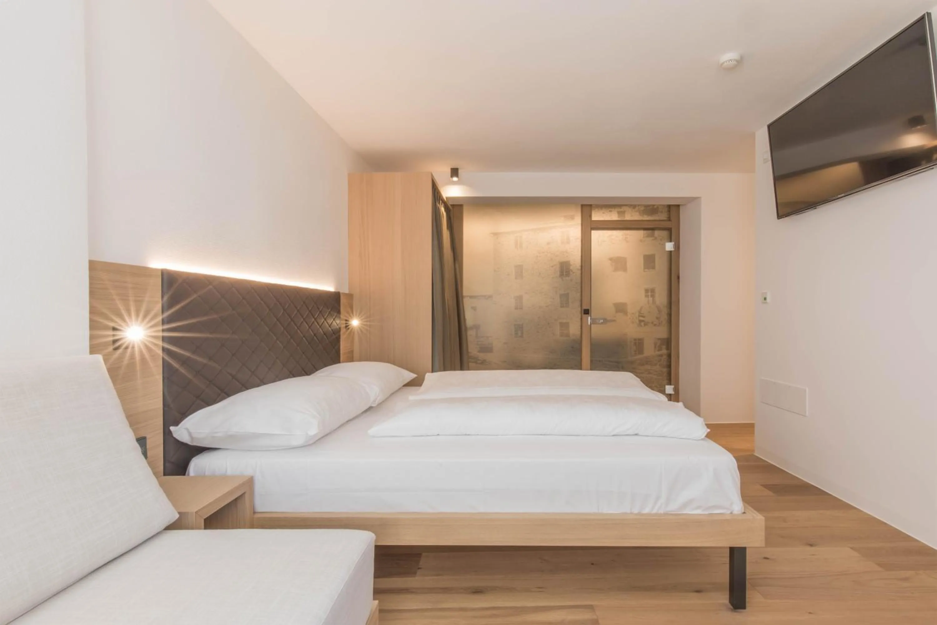 Bed in Belvenu Boutique Hotel