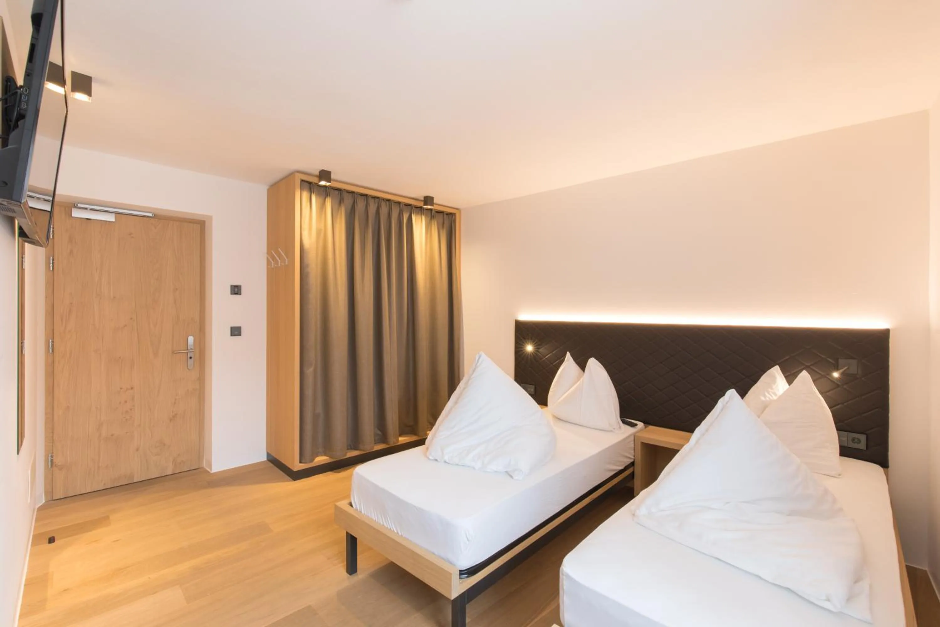 Bed in Belvenu Boutique Hotel