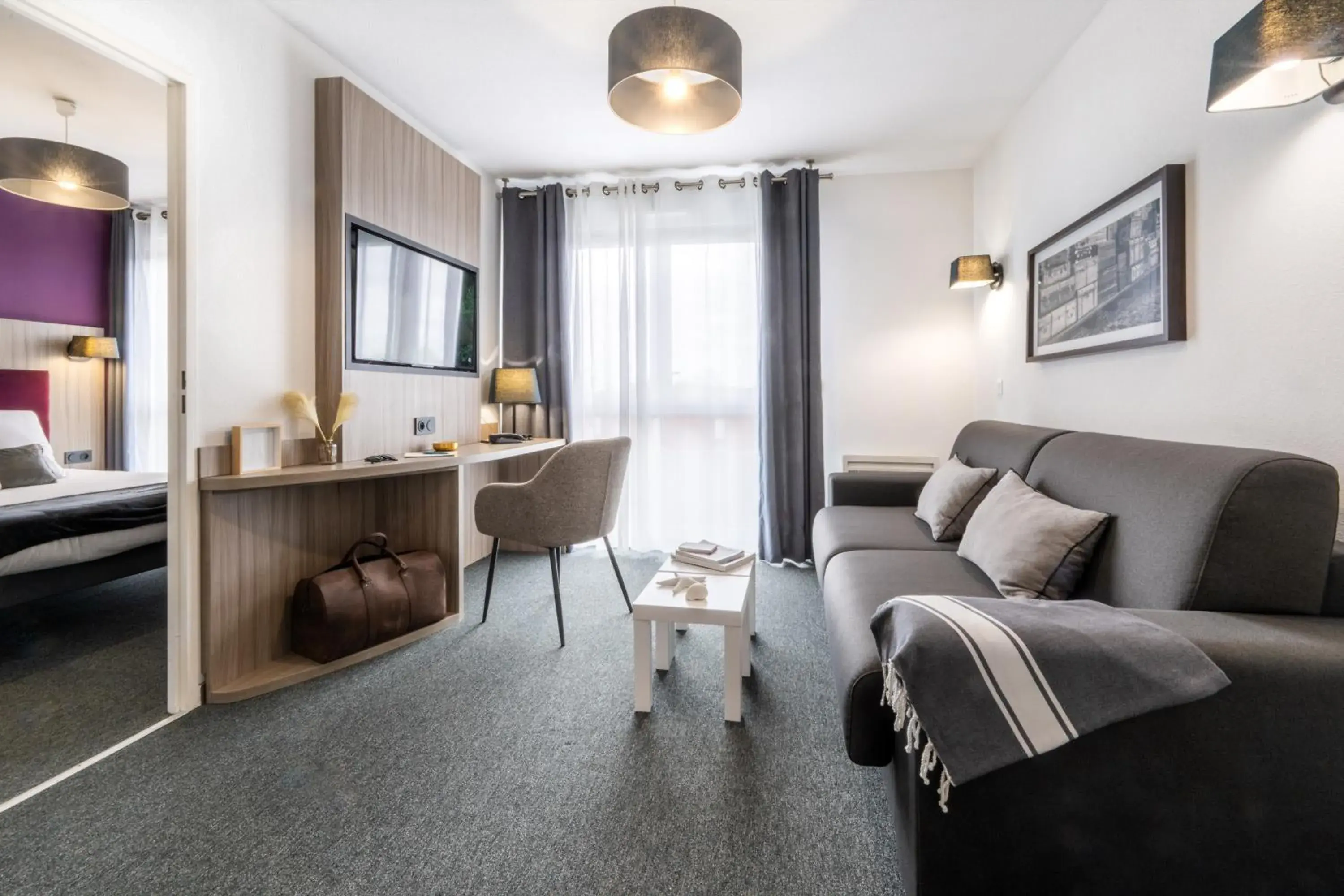 Seating area, Bed in Nemea Appart Hotel Stadium Bordeaux aéroport Seating area, Bed in Nemea Appart Hotel Stadium Bordeaux aéroport