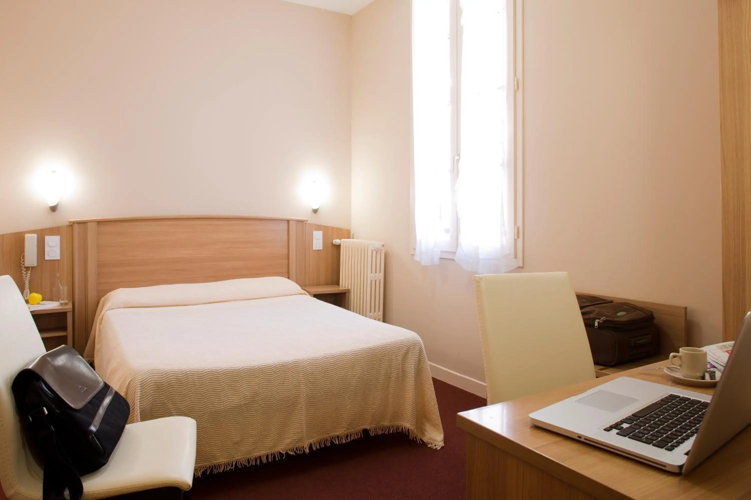 Photo of the whole room, Bed in Hôtel Le Commerce Photo of the whole room, Bed in Hôtel Le Commerce