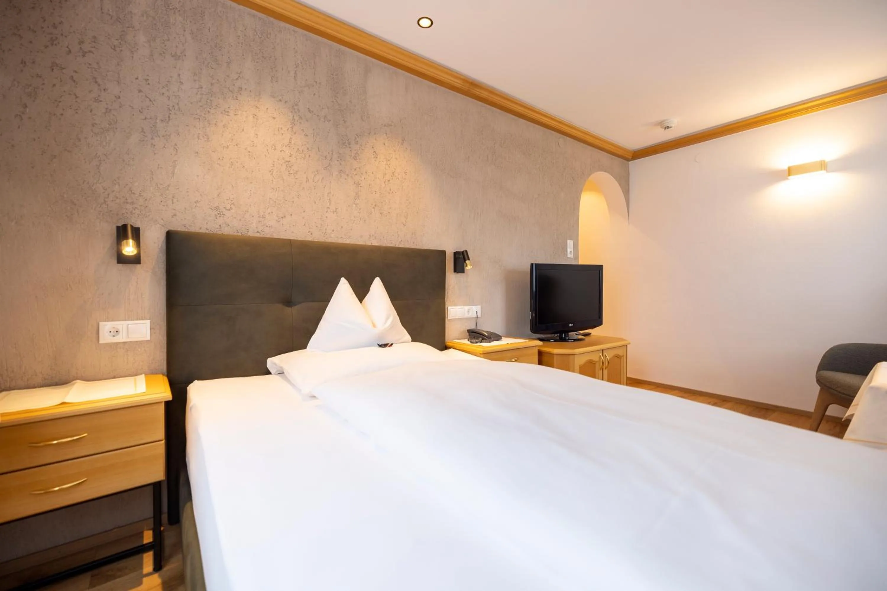 Photo of the whole room, Bed in Parkhotel Seefeld