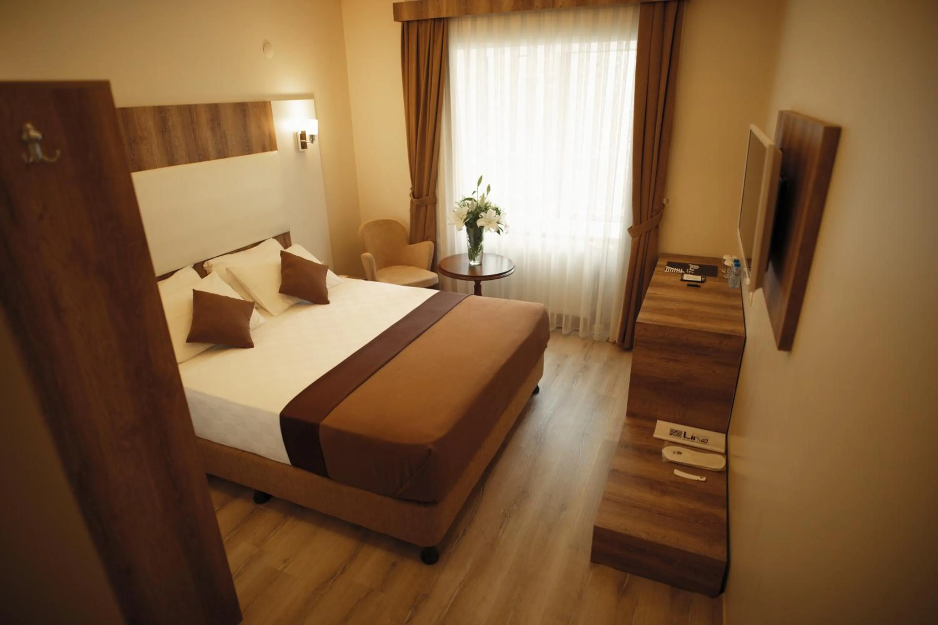 Photo of the whole room, Bed in Line Suite Hotel