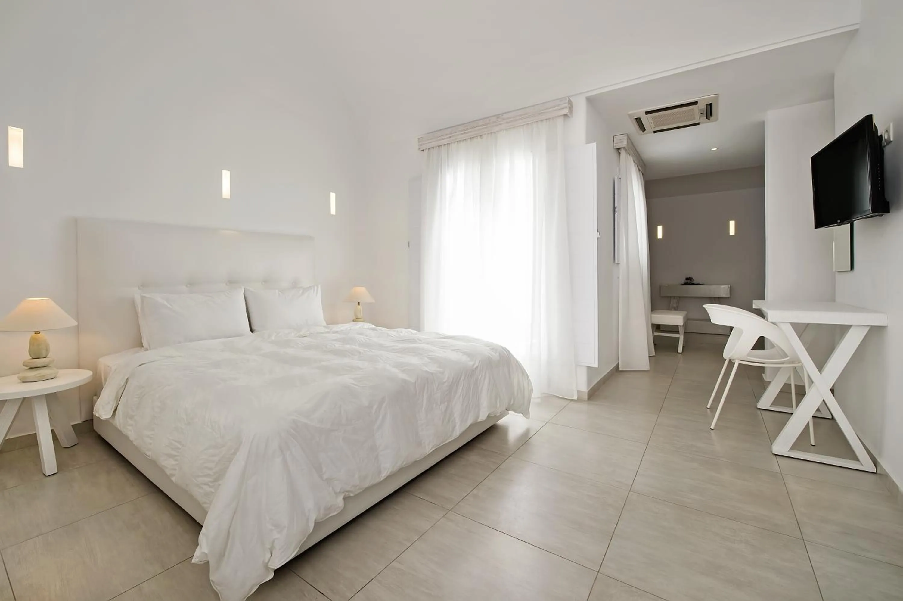 Photo of the whole room, Bed in Cavo Bianco Boutique Hotel & Spa