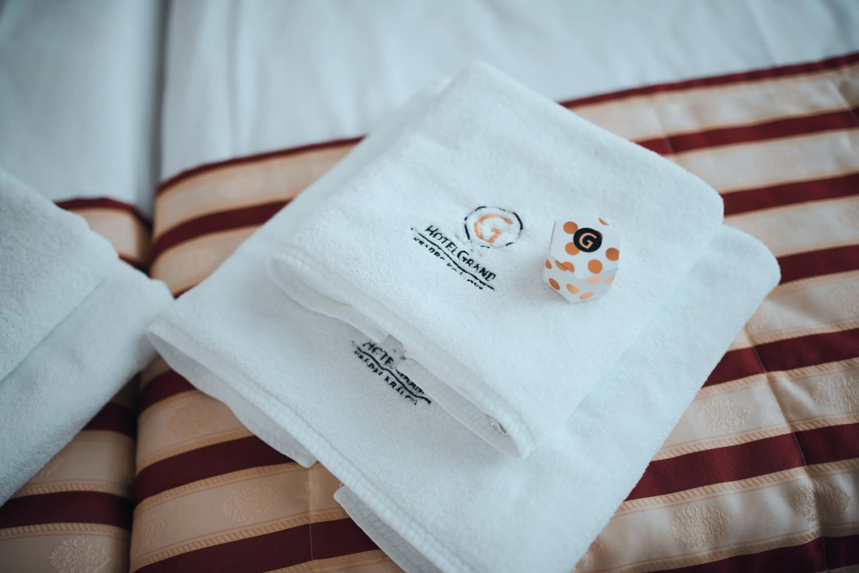 towels, Bed in Hotel Grand