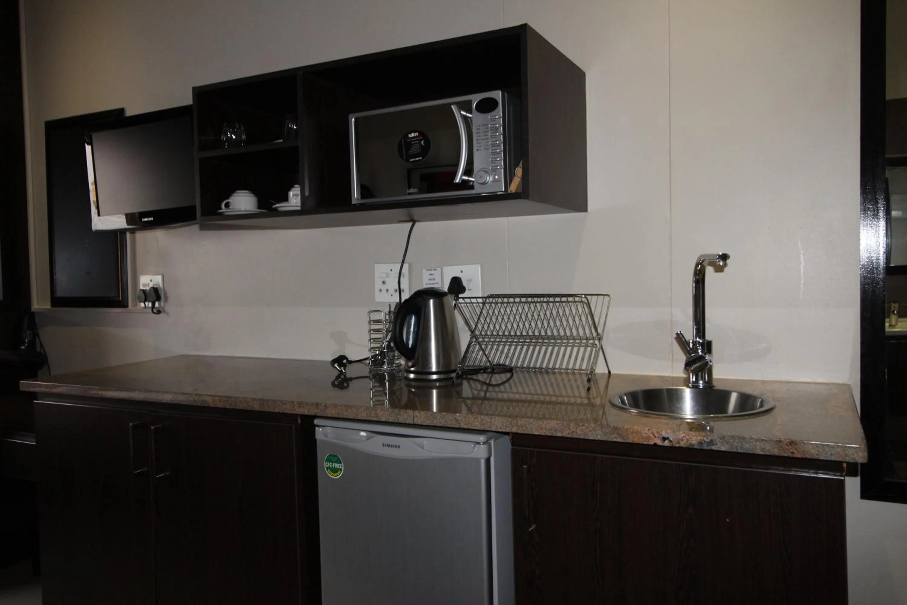 Kitchen or kitchenette in Alcazaba Hotel