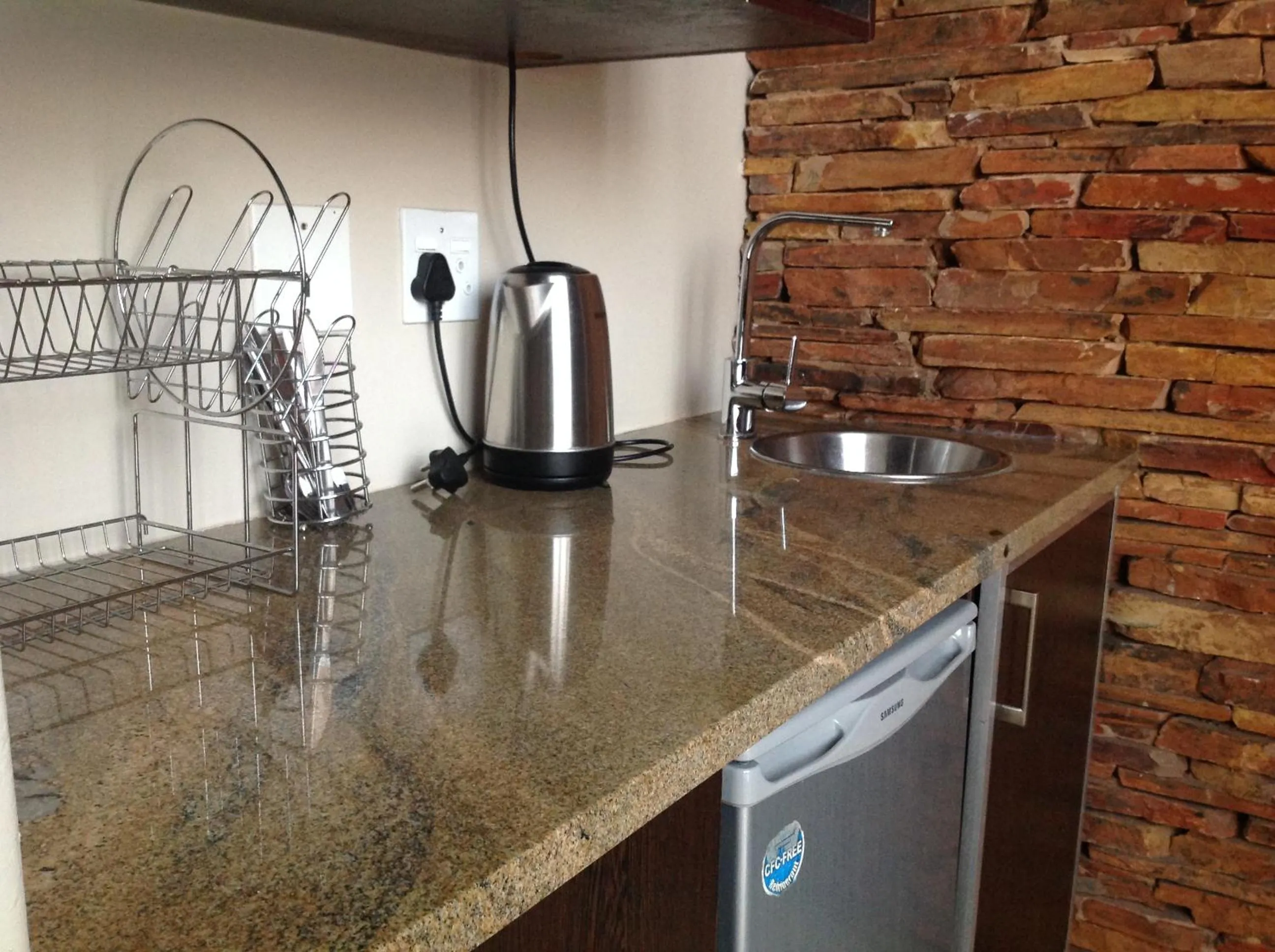 Kitchen or kitchenette in Alcazaba Hotel