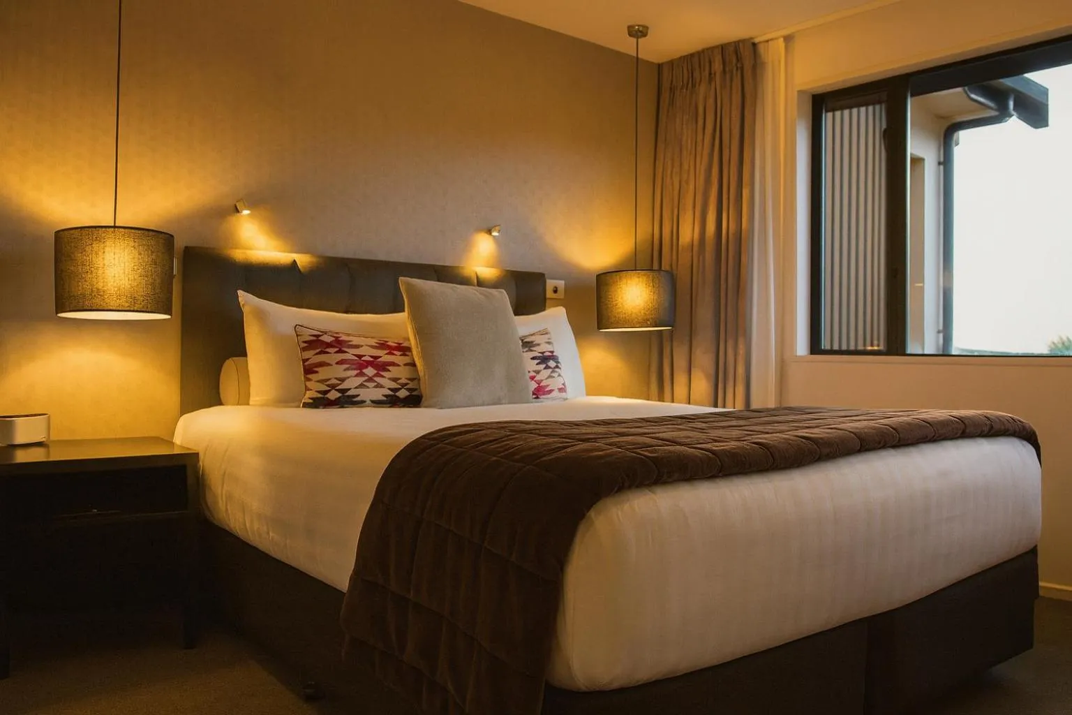 Bed in Village Lake Luxury Apartments