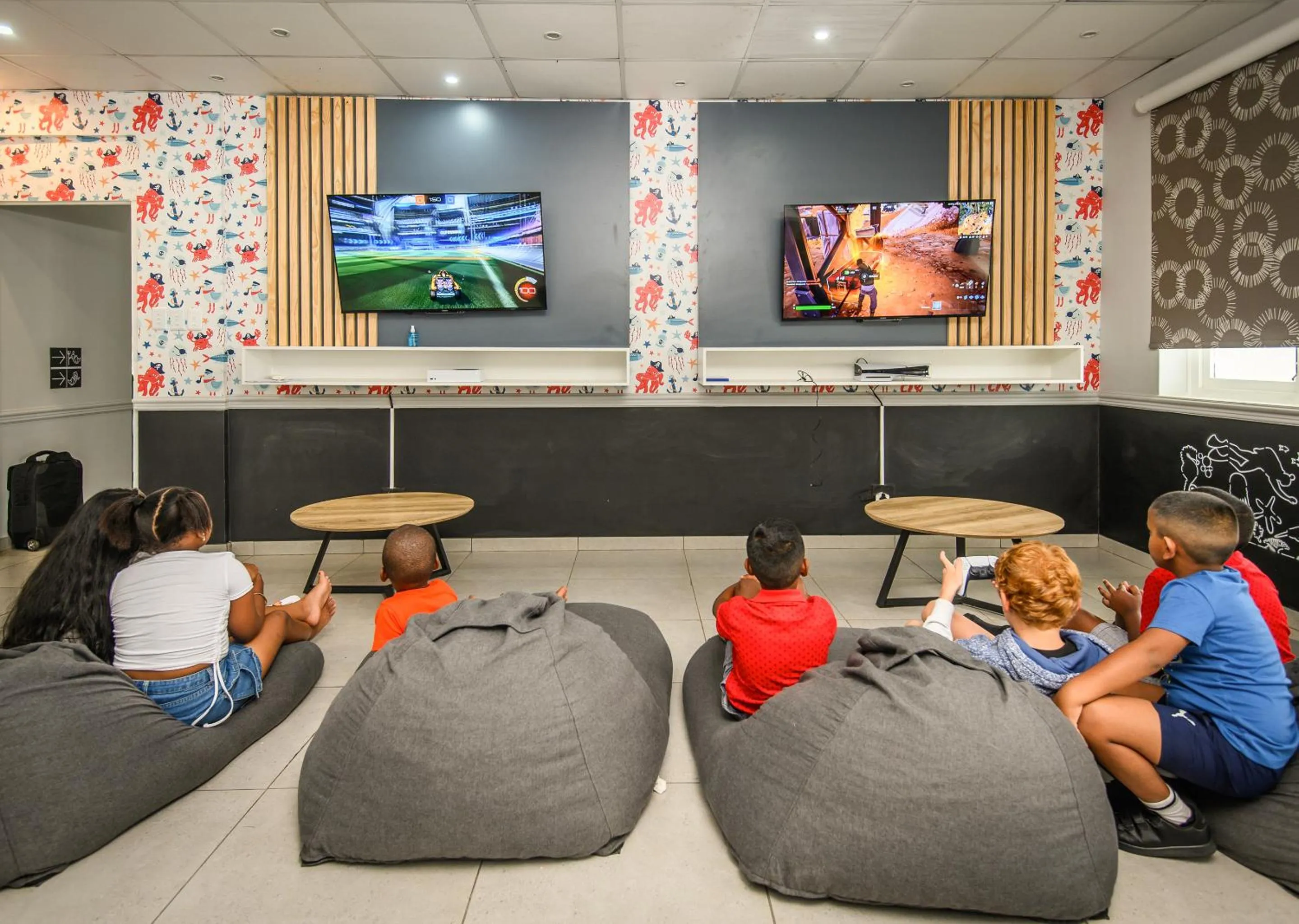 Communal lounge/ TV room in Blue Marlin All-Inclusive Seascape by Dream Resorts