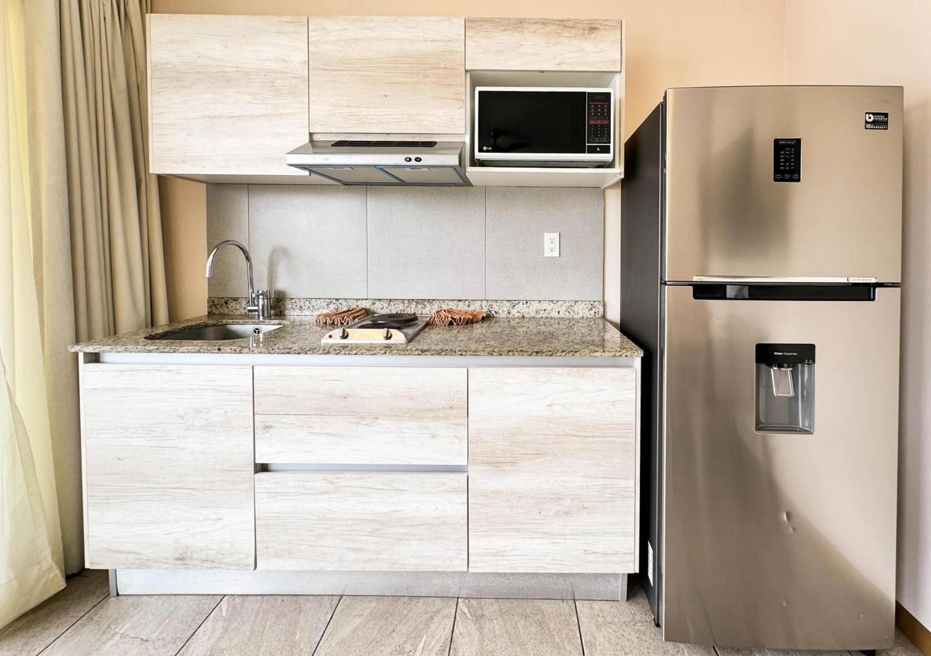 Kitchen or kitchenette in Grand Fifty Suites