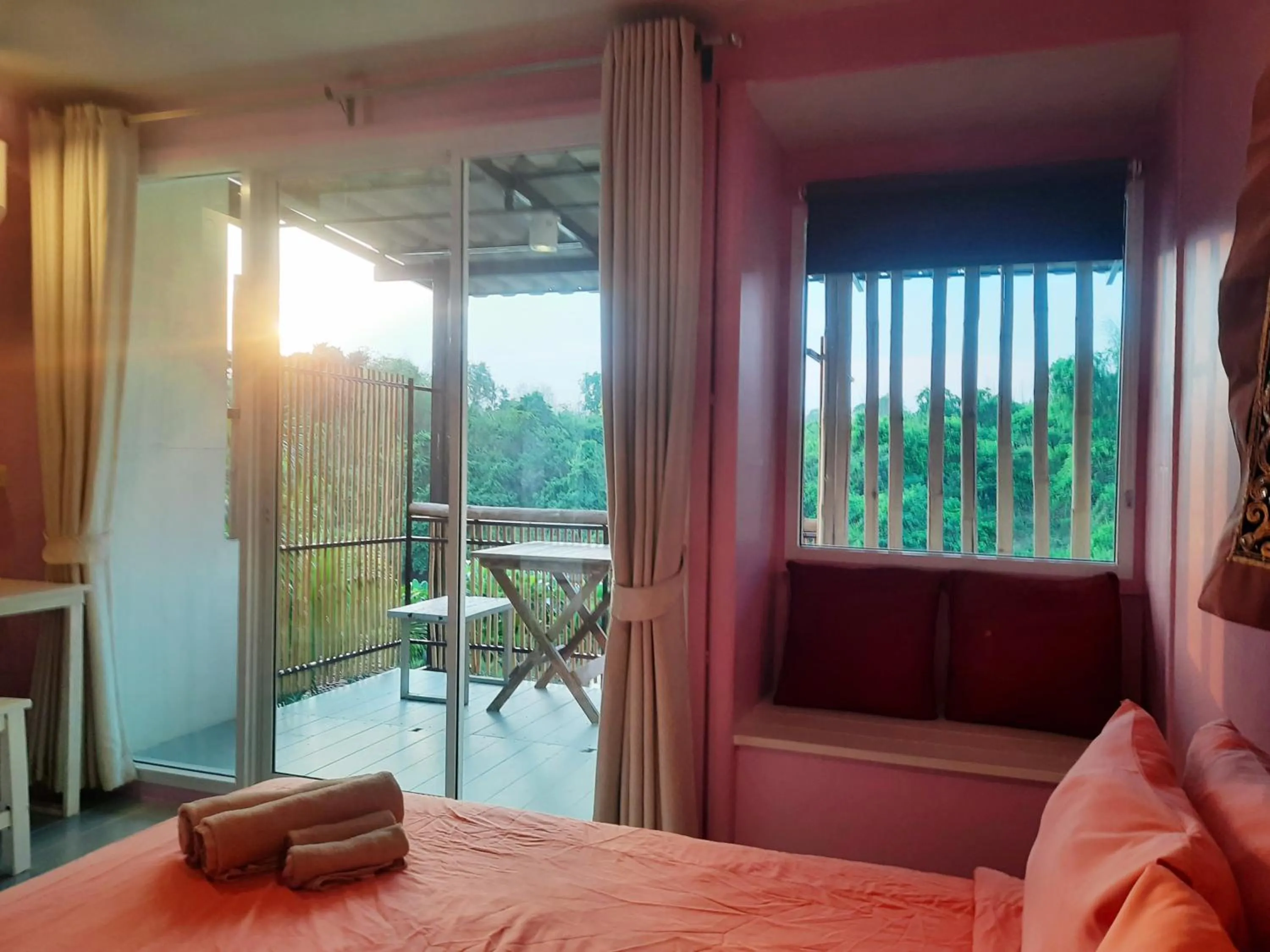 Bed in Chasorn Riverside Resort