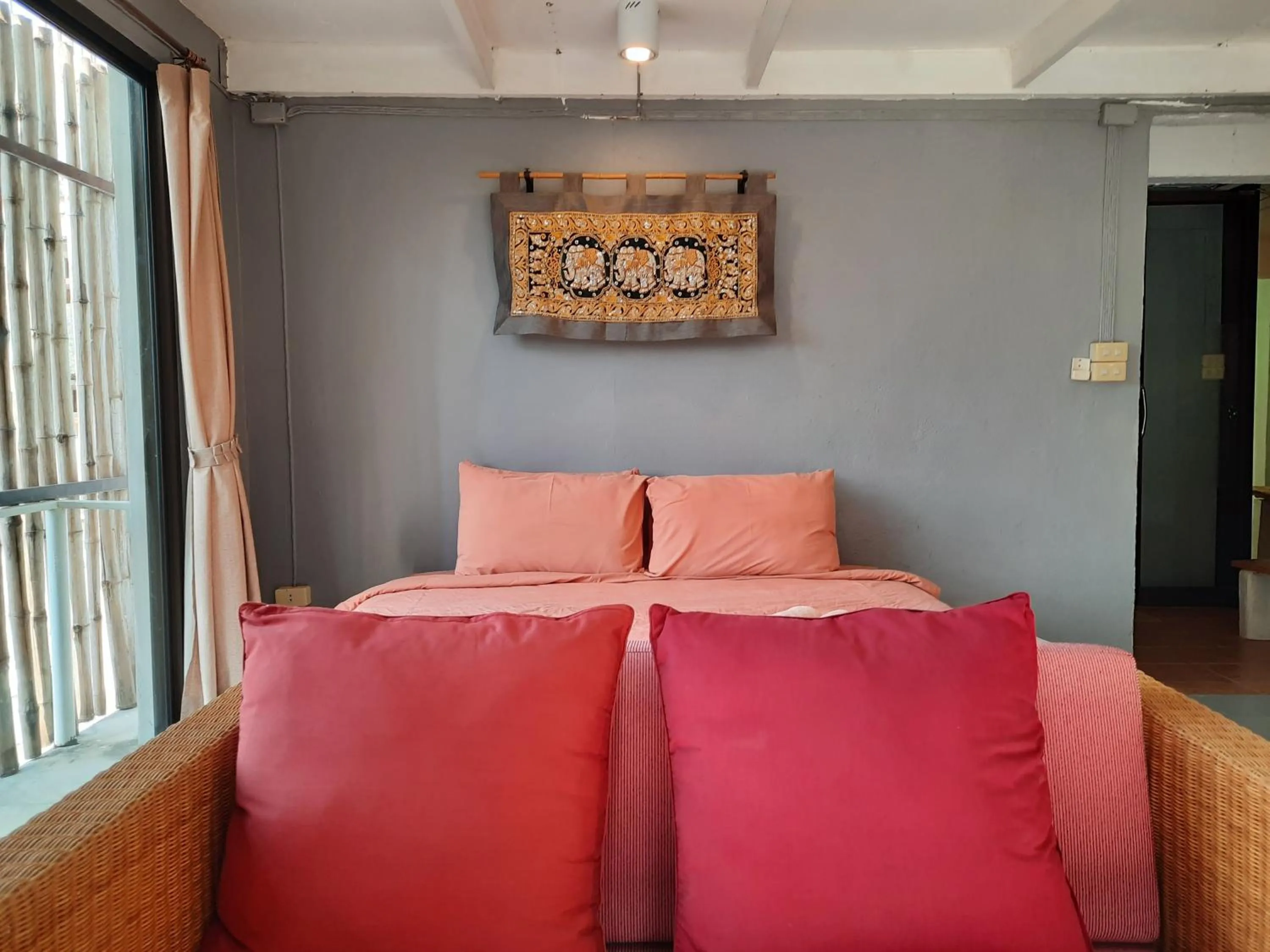 Bed in Chasorn Riverside Resort