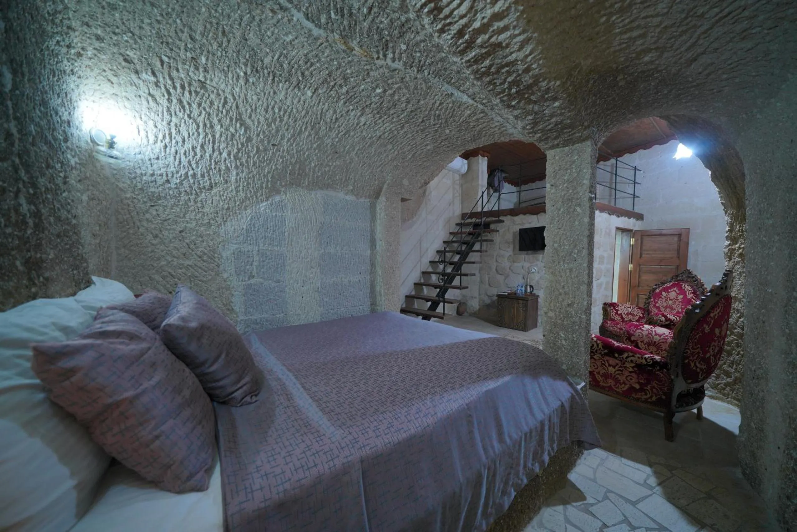 Bed in Holiday Cave Hotel