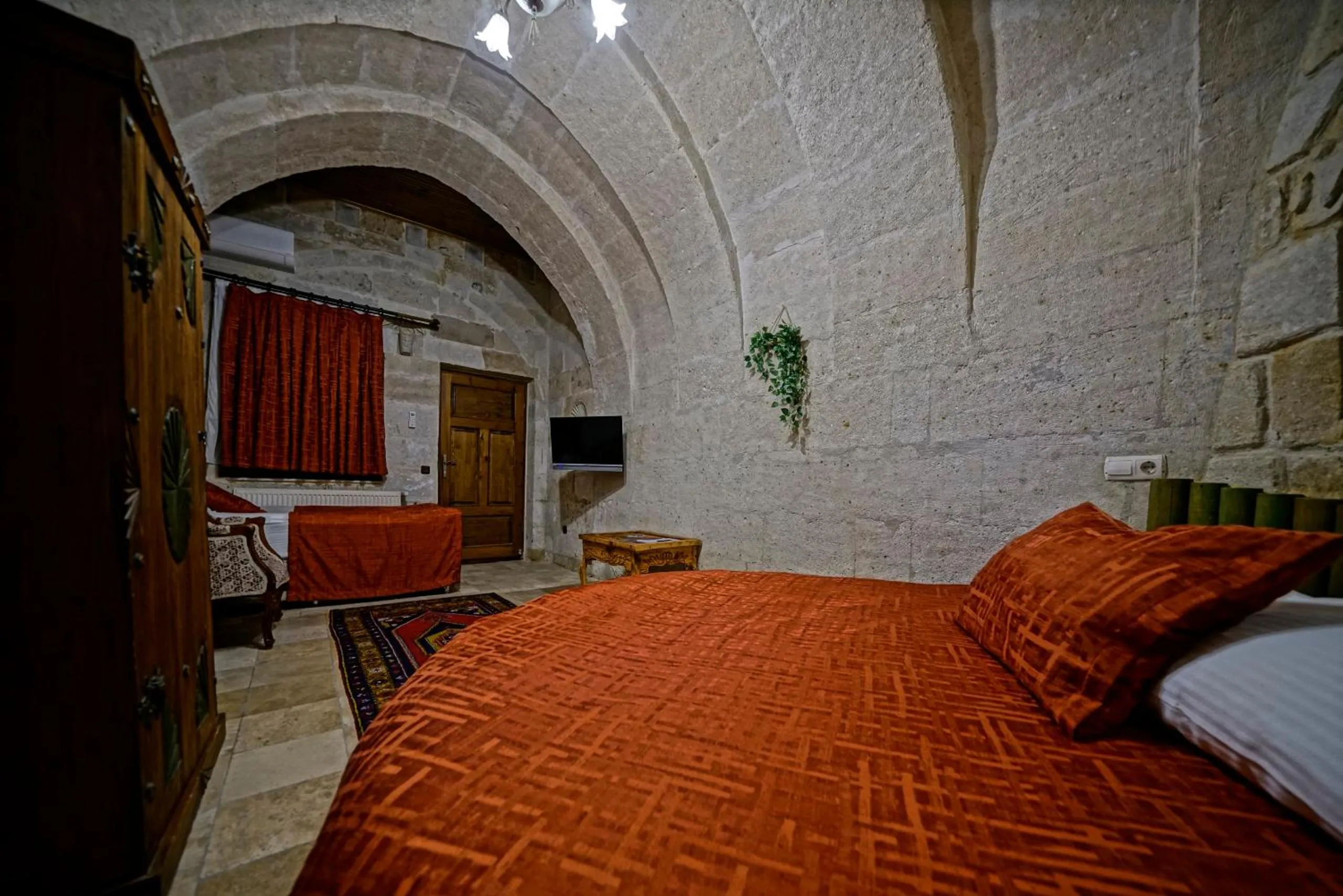 Bed in Holiday Cave Hotel