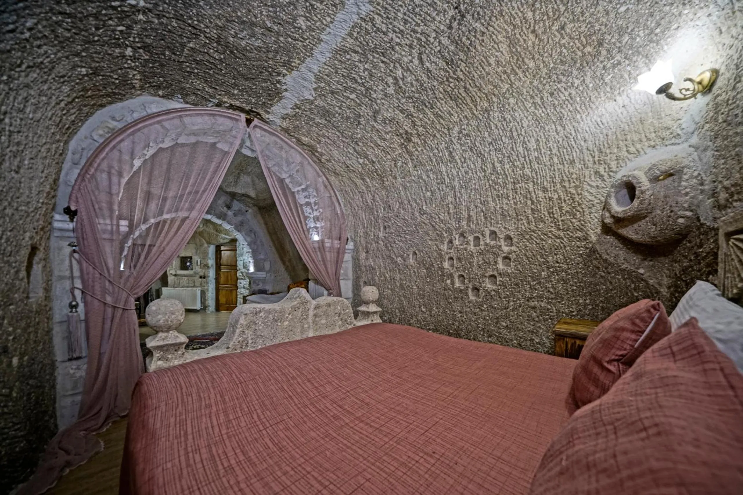 Bed in Holiday Cave Hotel