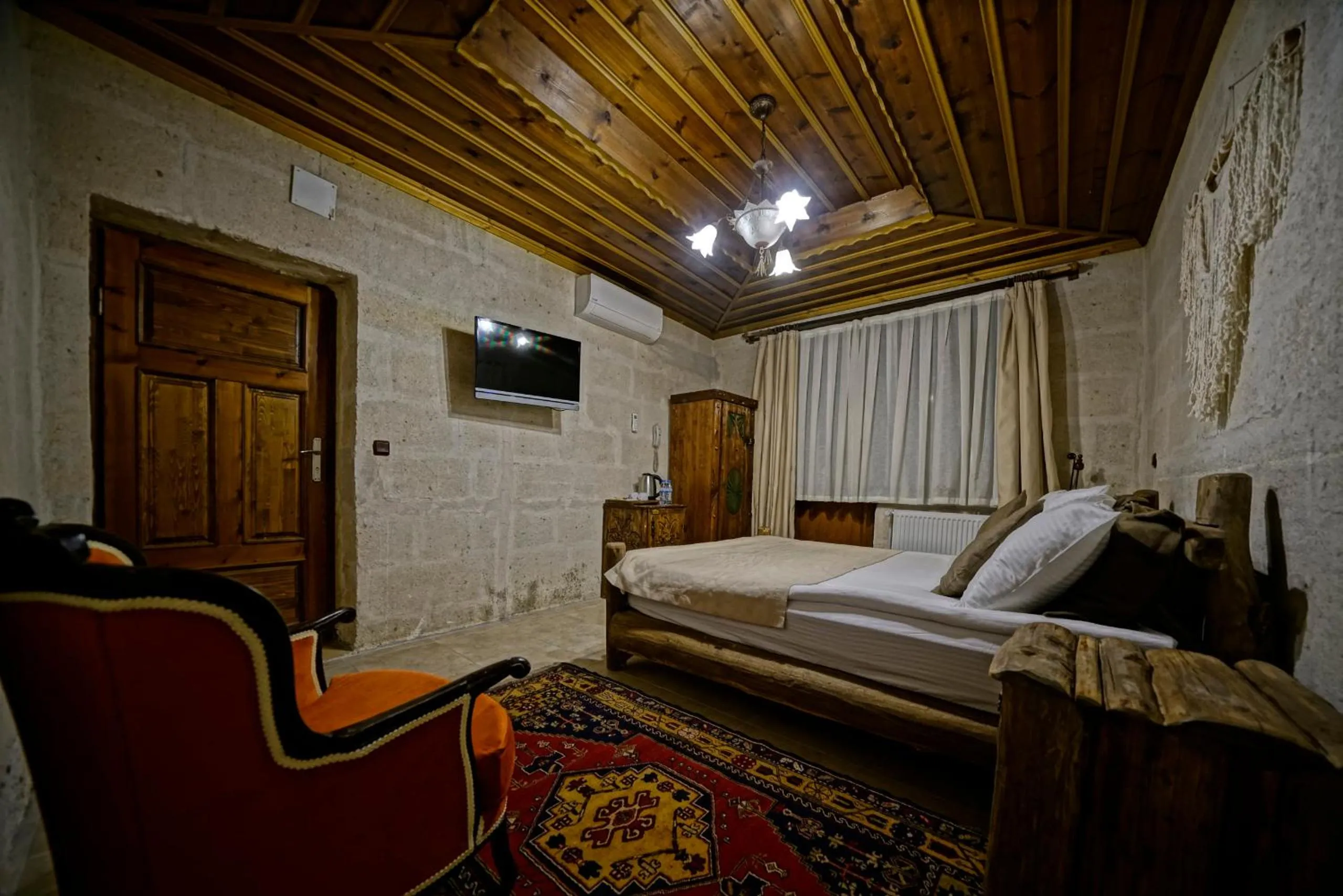 Bed in Holiday Cave Hotel