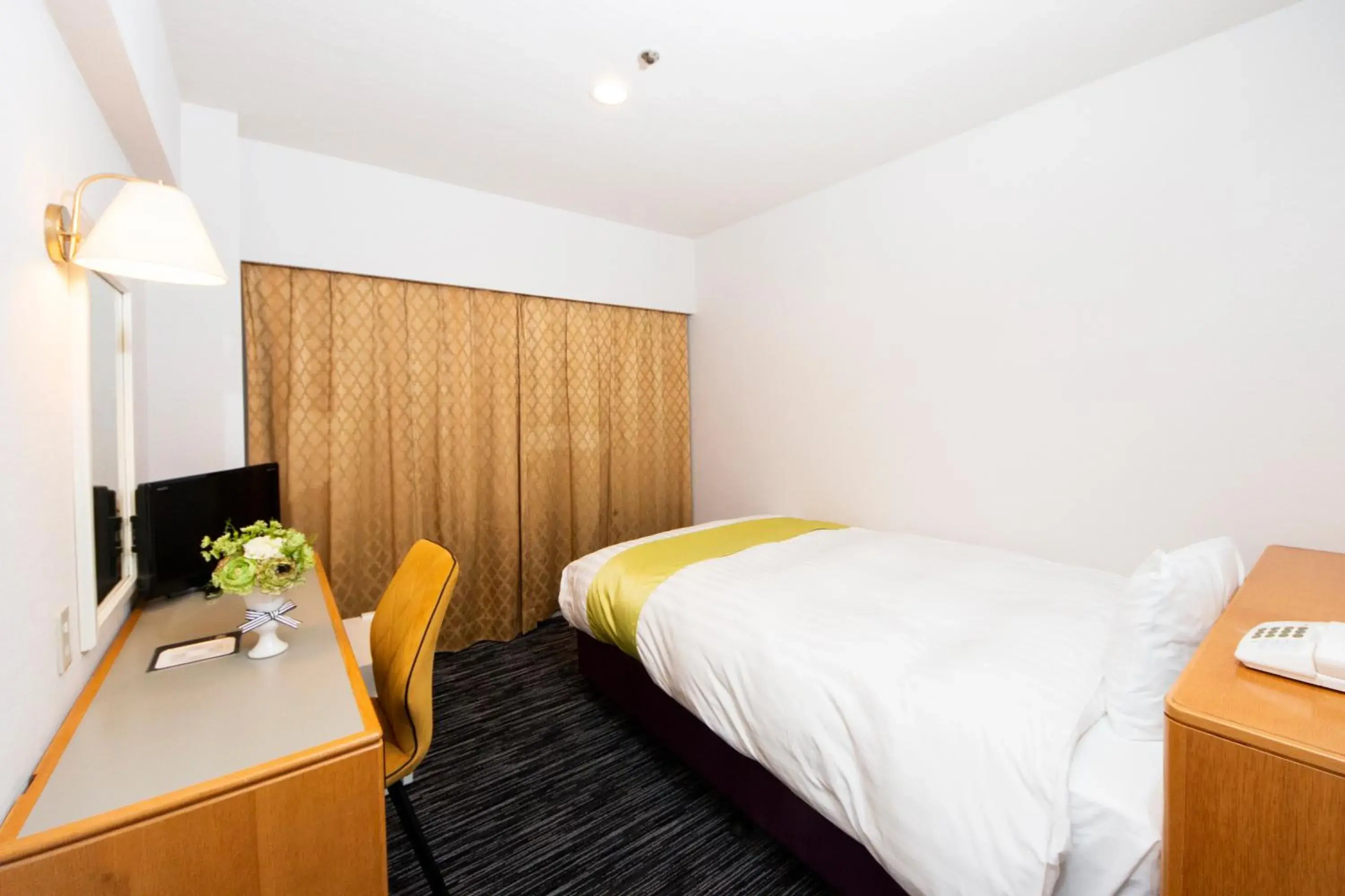 Bed in Hotel Montoview Yonezawa Bed in Hotel Montoview Yonezawa