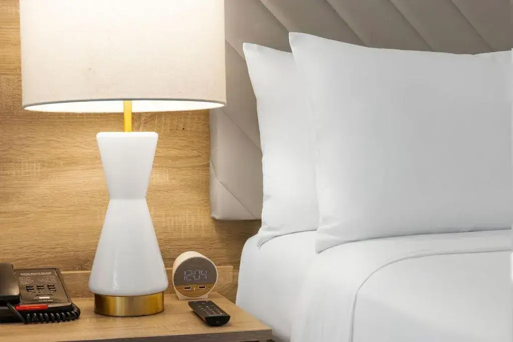 Bed in The Garden Hotel & Resort Bed in The Garden Hotel & Resort