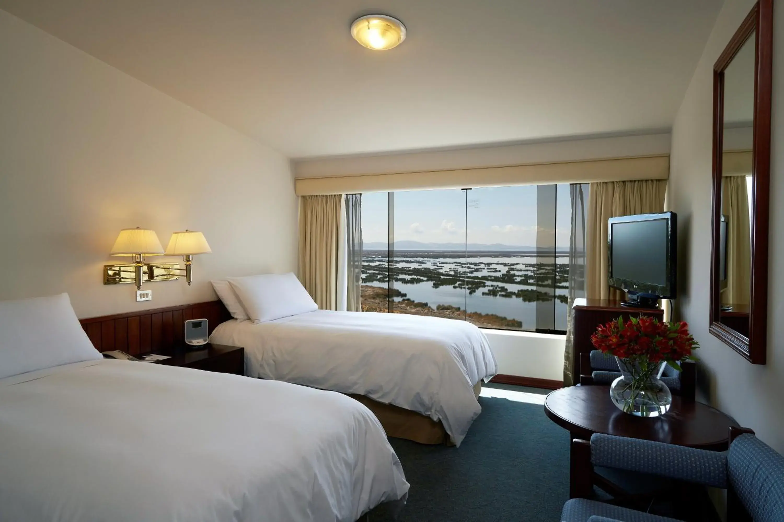 Lake view, Bed in GHL Hotel Lago Titicaca Lake view, Bed in GHL Hotel Lago Titicaca