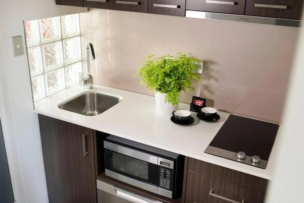Kitchen or kitchenette in Pier 21 Riverside Apartment Hotel
