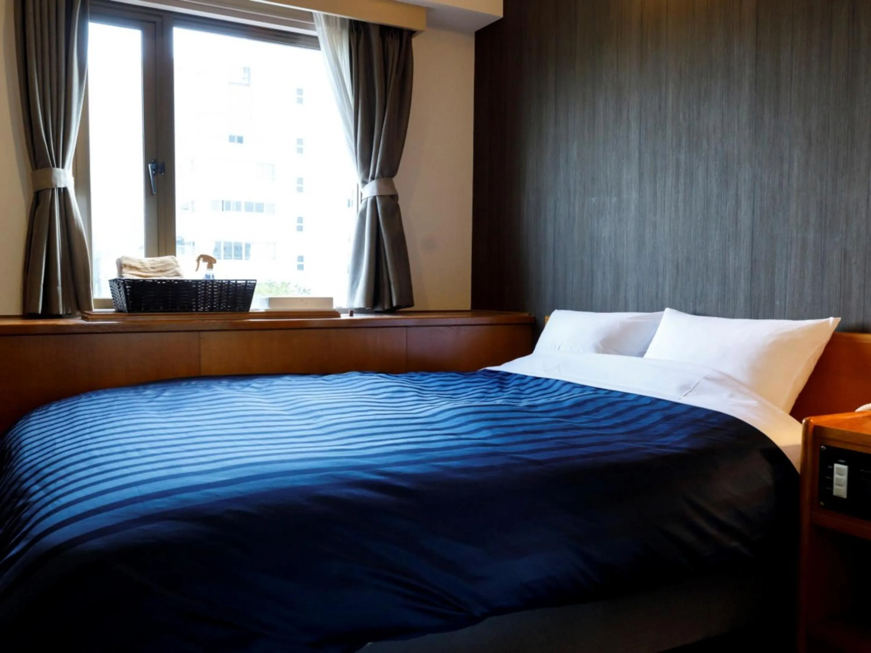 Bed in Miyazaki Lions Hotel