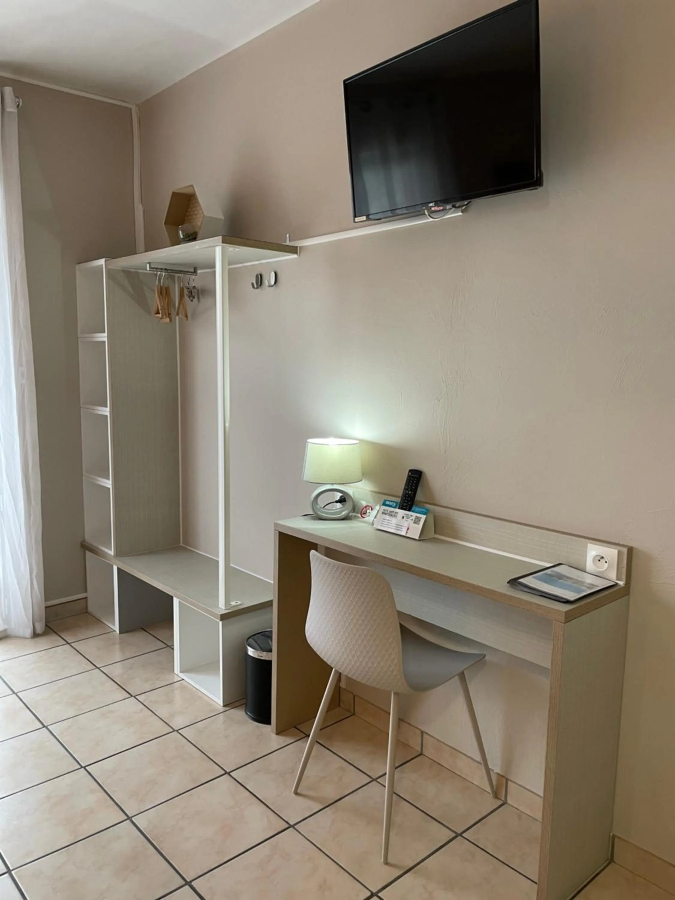 Bedroom in Logis Hôtel Le Clement V