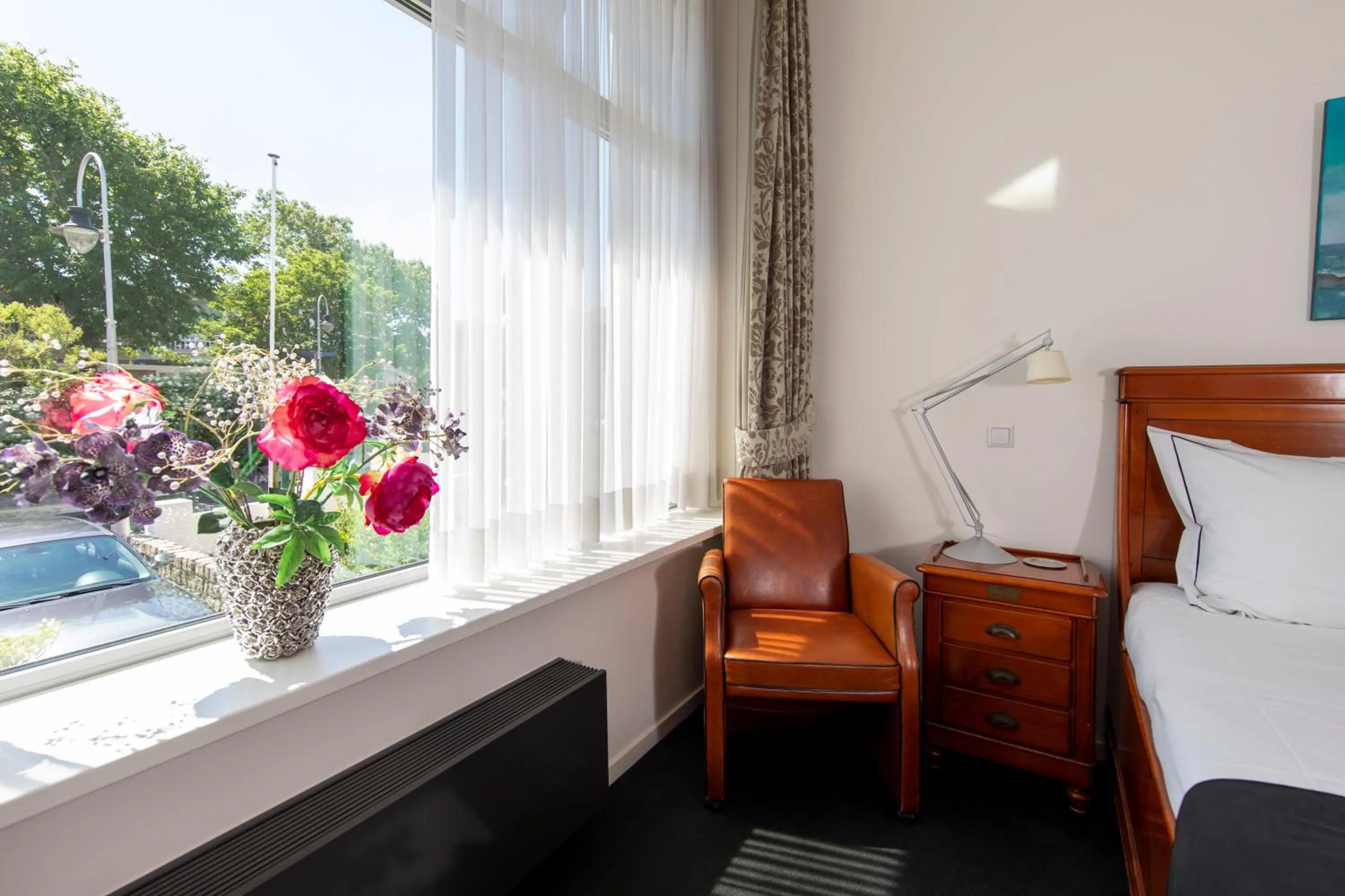 Seating area, Bed in Hotel La Rosa Amsterdam Beach