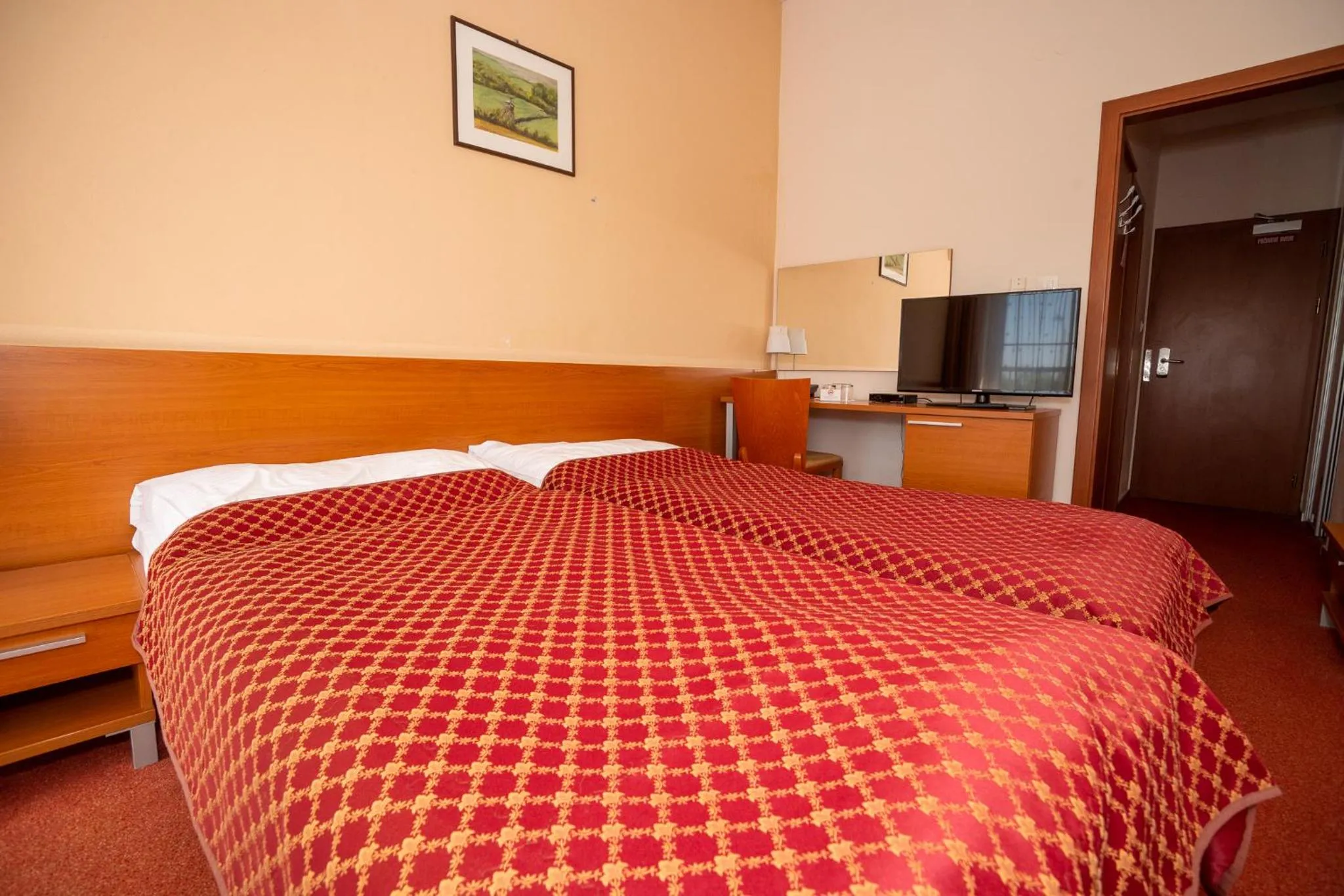 Bed in Hotel Dominika