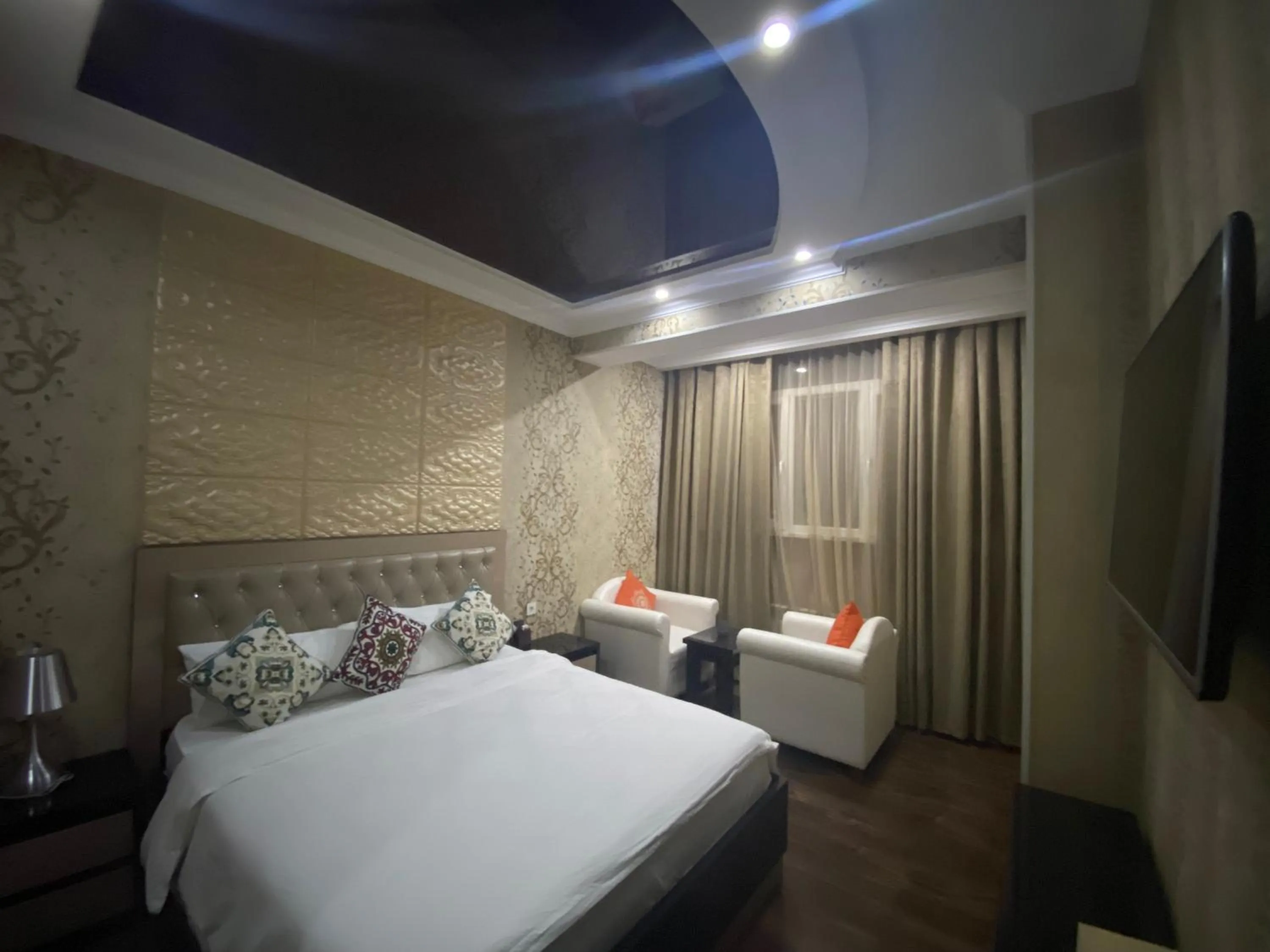 Bed in Sunrise Apartments