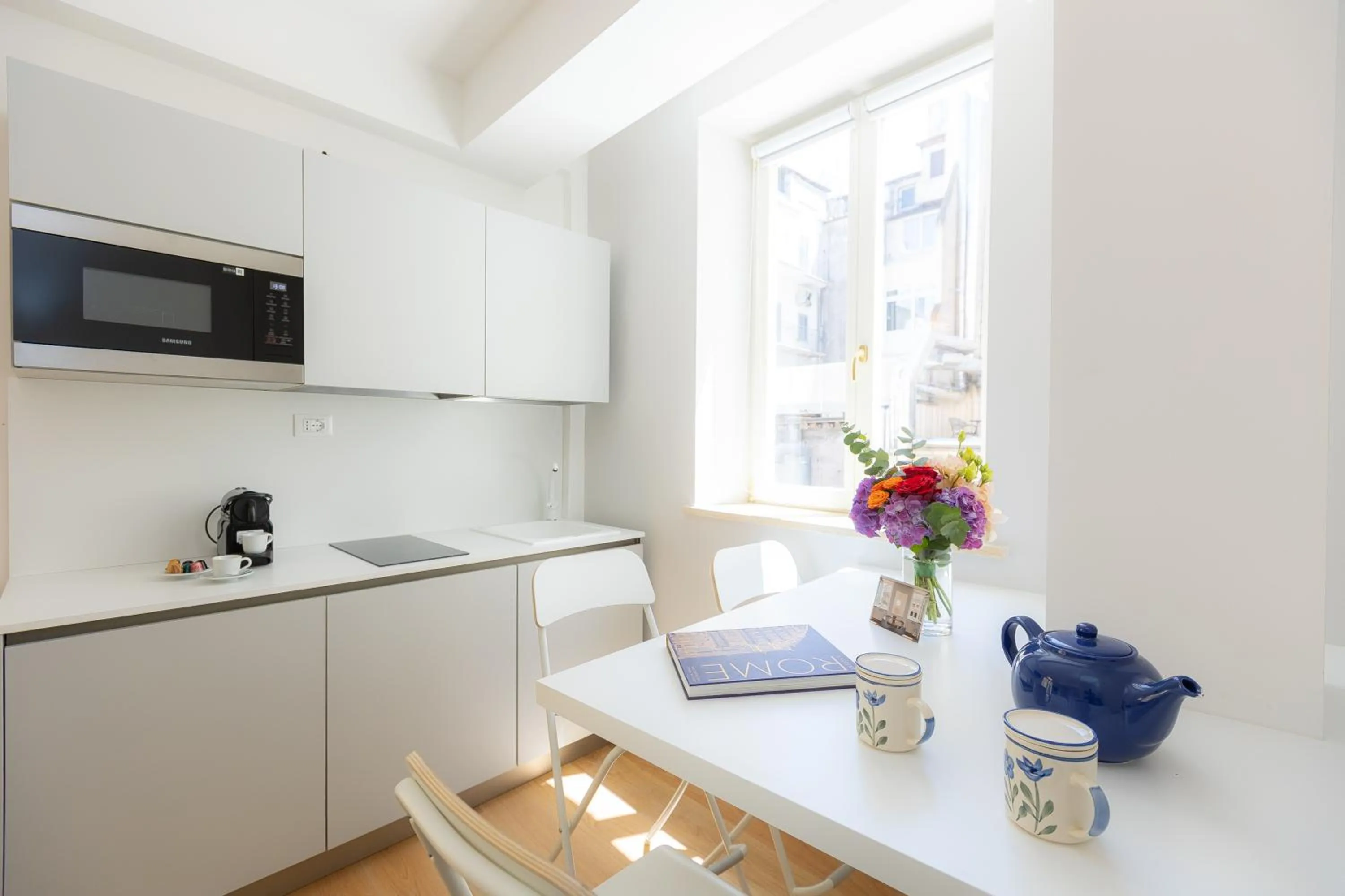 Kitchen or kitchenette in Amazing Piazza Venezia Suites