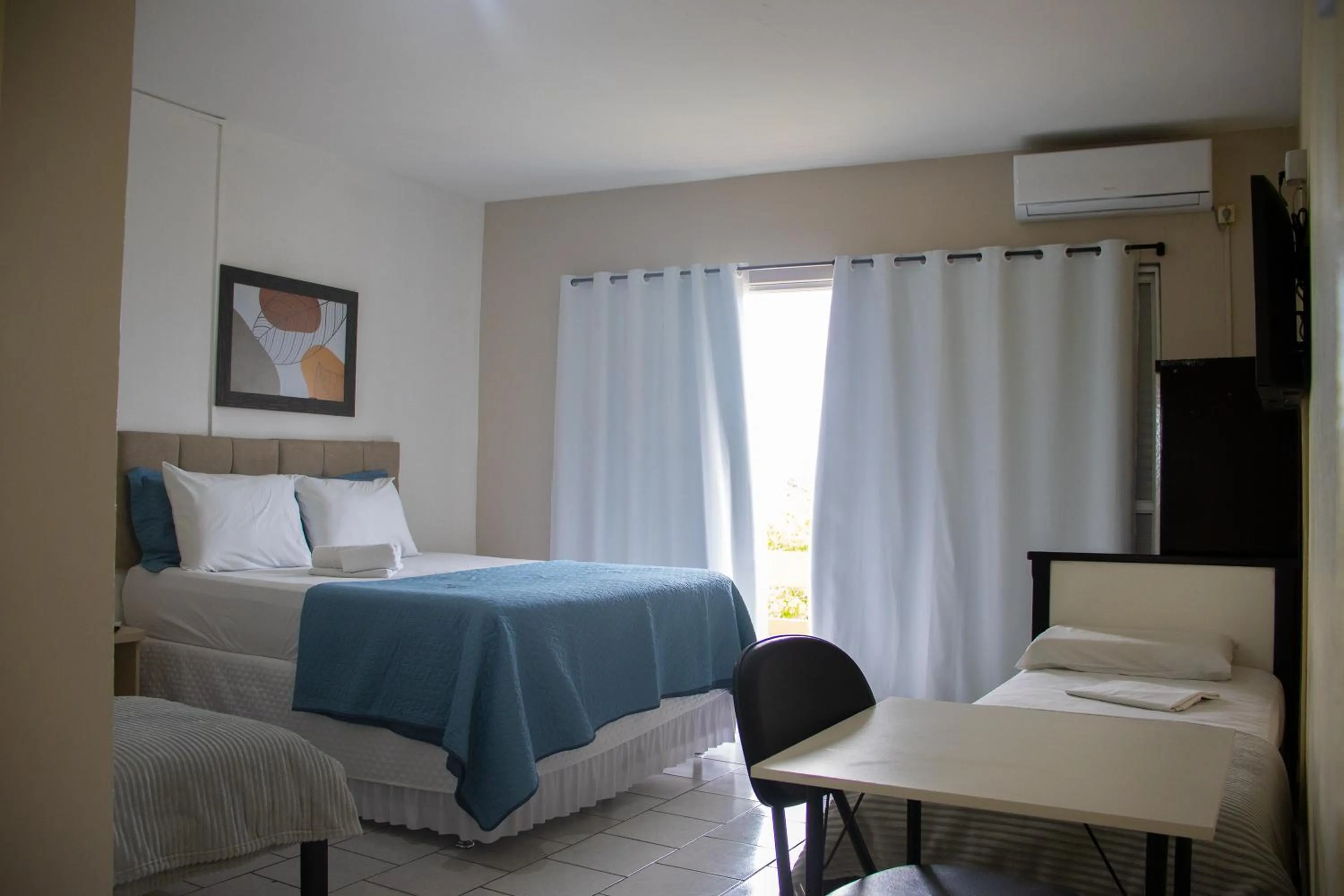 Bed in Simar Hotel