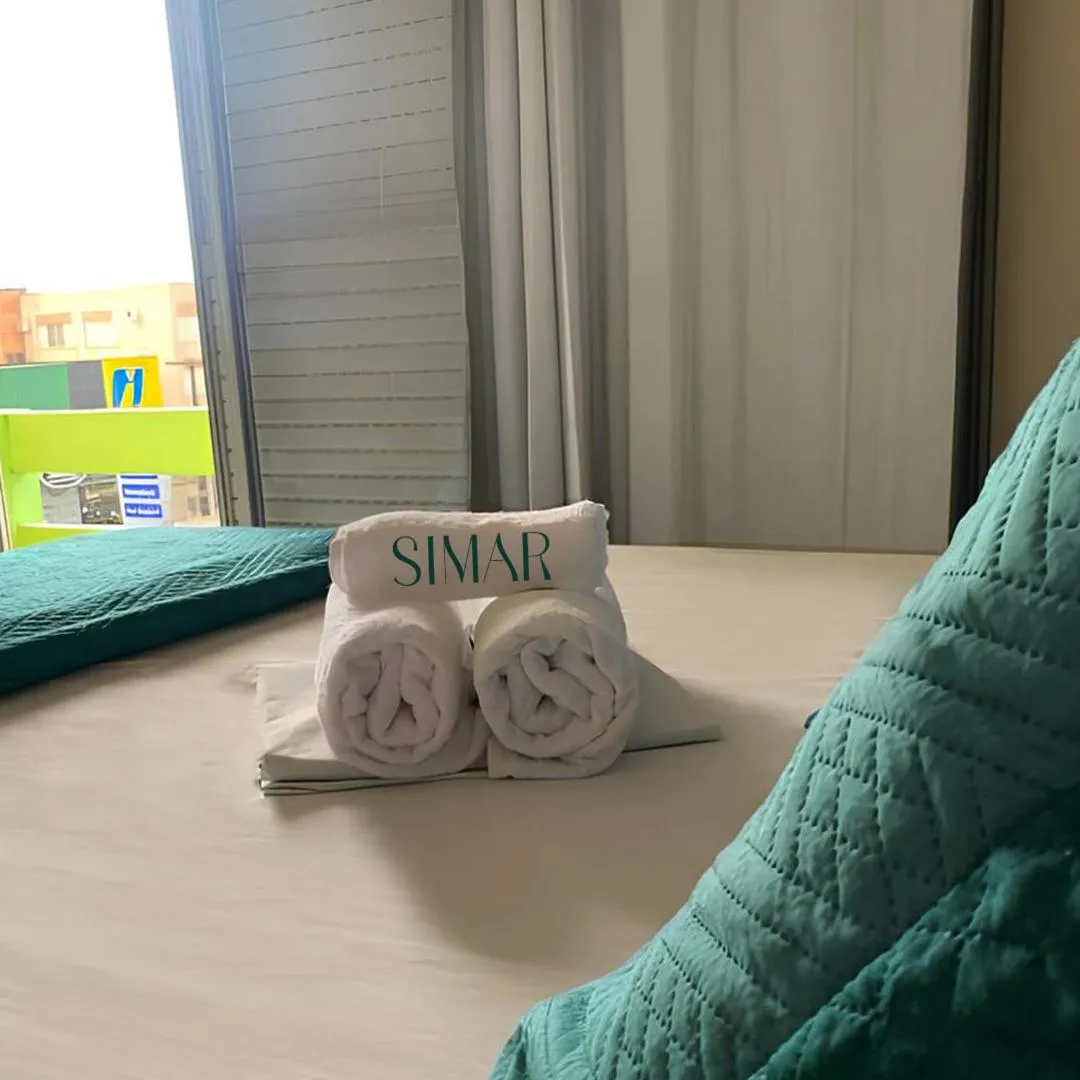 Bed in Simar Hotel