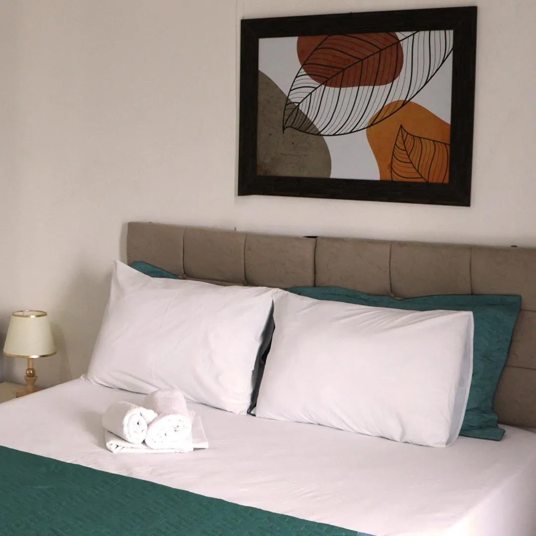 Bed in Simar Hotel