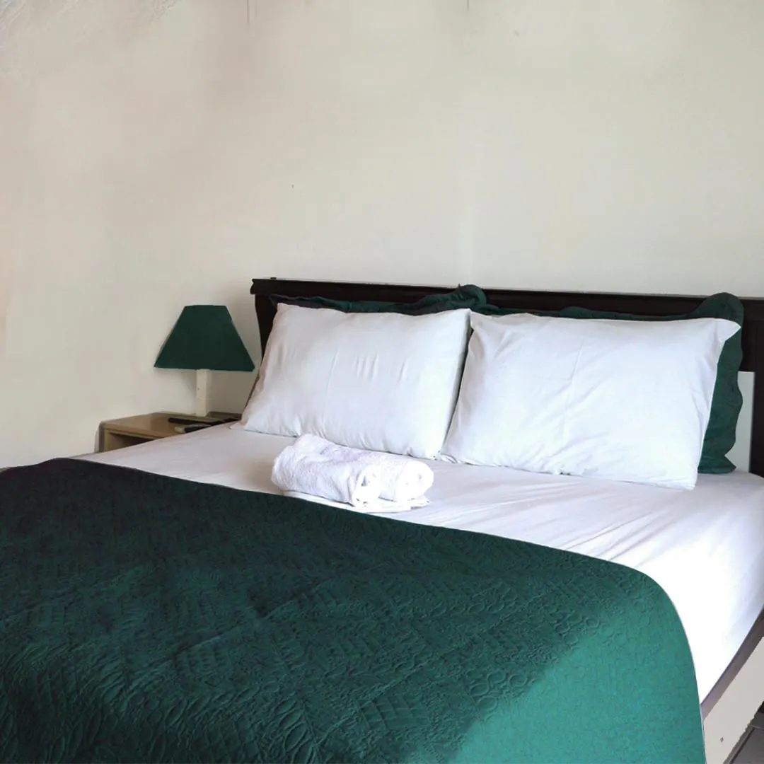 Bed in Simar Hotel