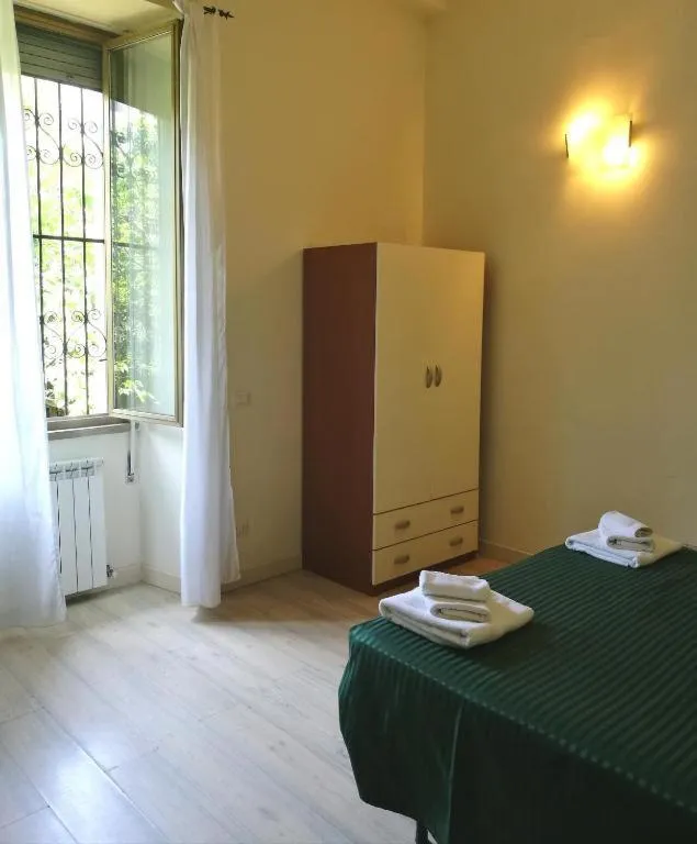 Photo of the whole room, Bed in Palma Residences In Rome