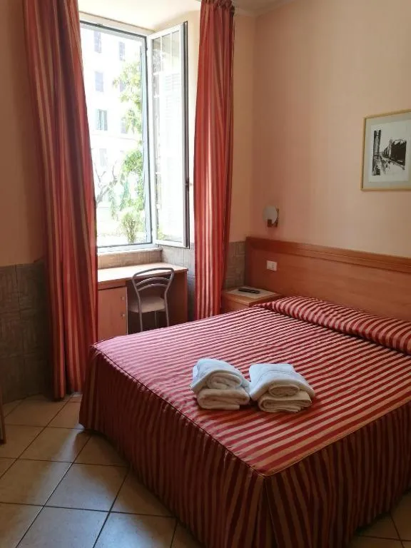 Photo of the whole room, Bed in Palma Residences In Rome