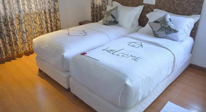 Bed in Turquoise Residence by UI