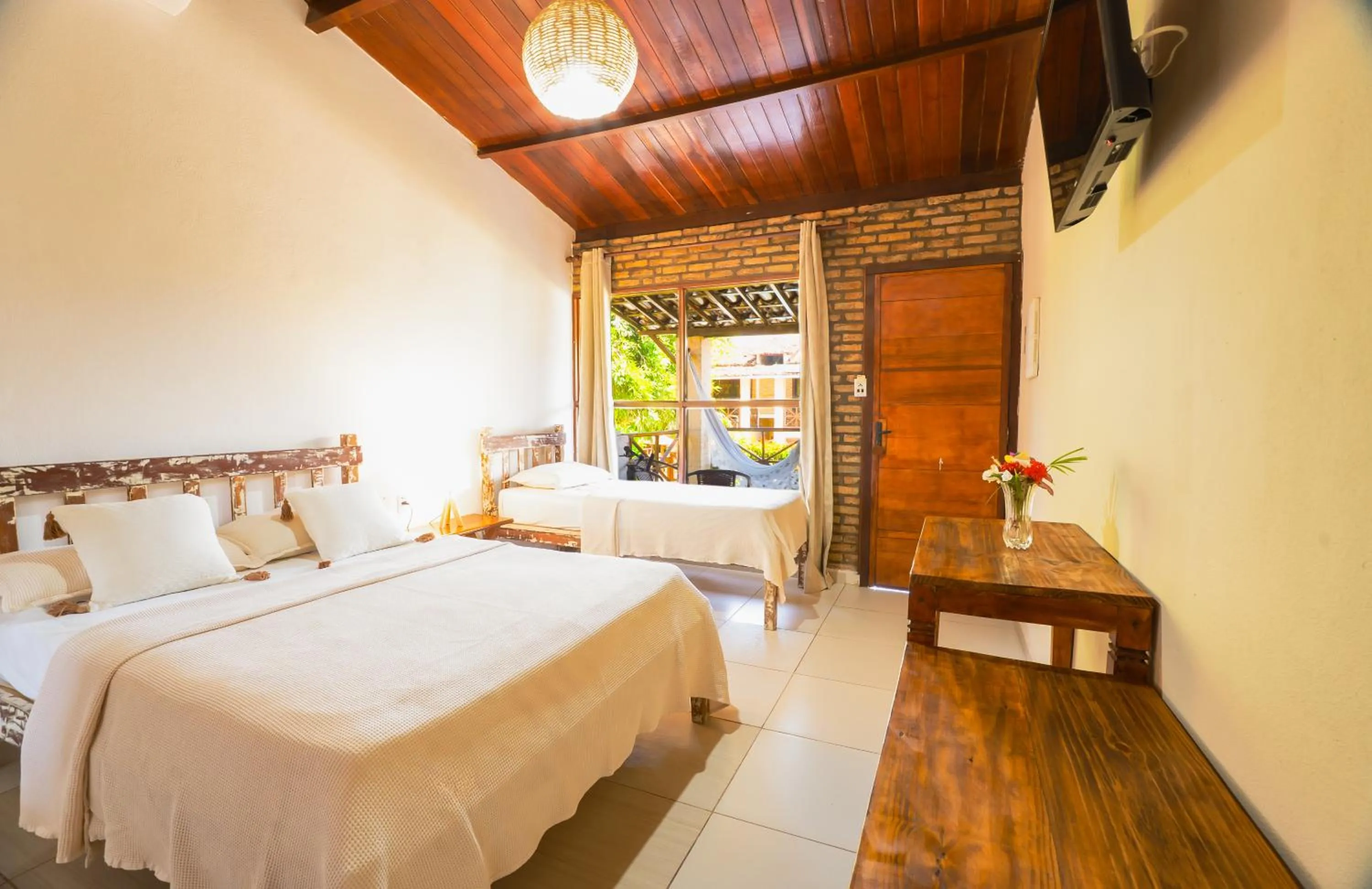 Bed in Pousada Bicho Preguiça