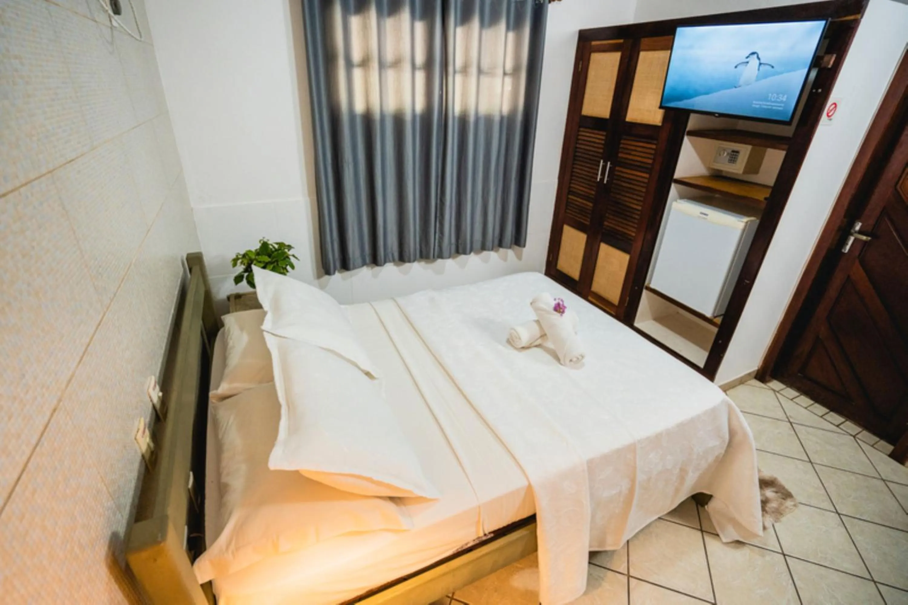 Bed in Pousada Bicho Preguiça