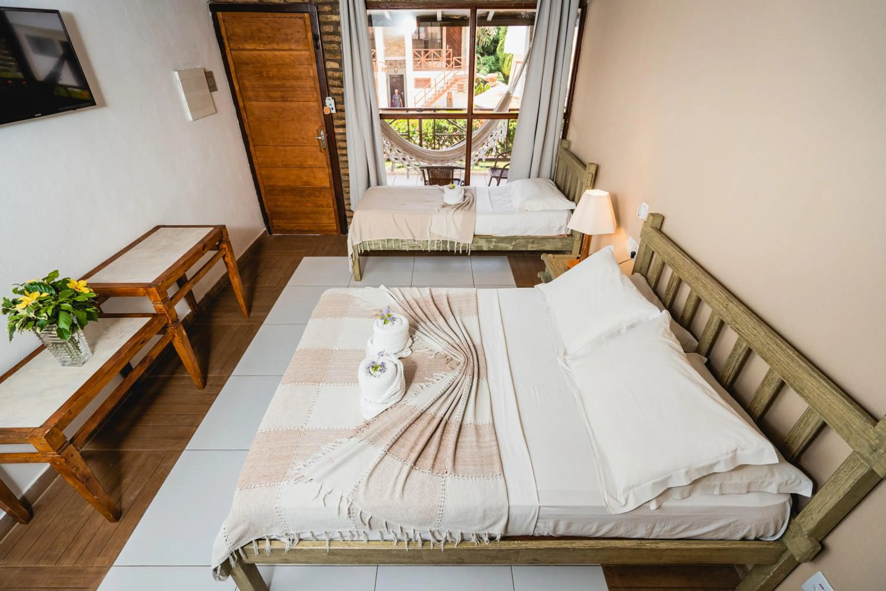 Bed in Pousada Bicho Preguiça