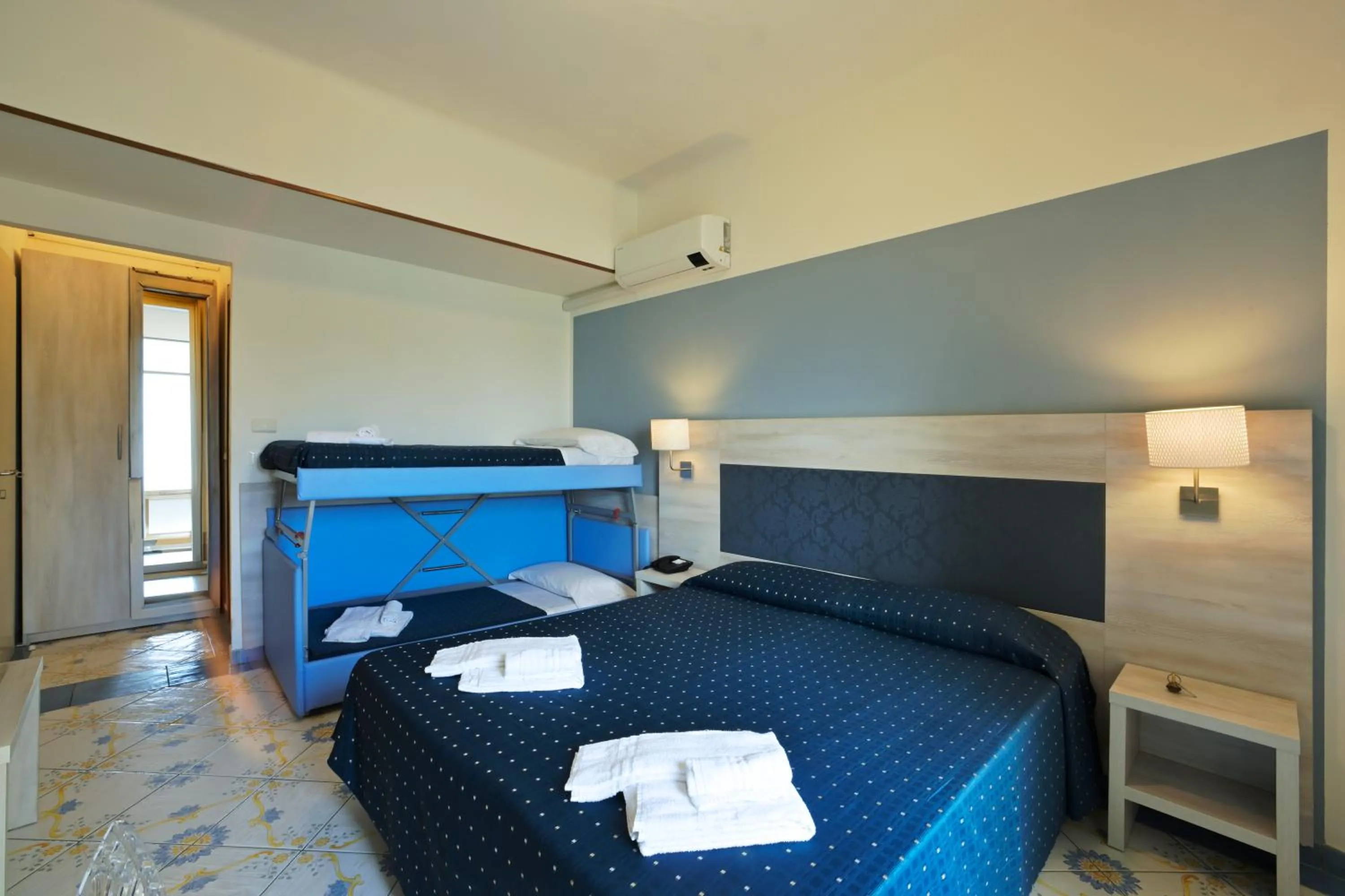 Bed in Hotel Delfino