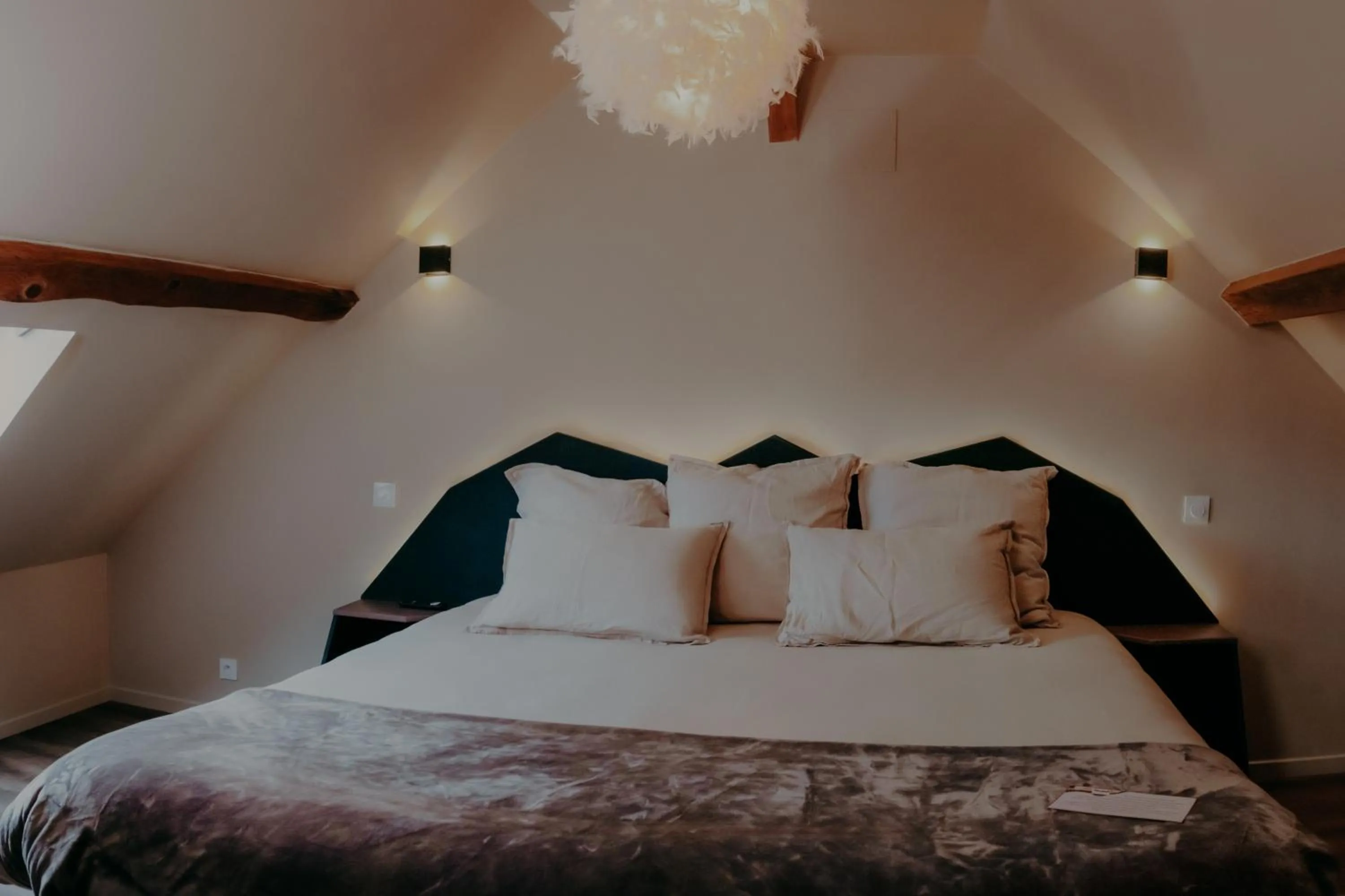 Bed in Le Central Hôtel-Bar