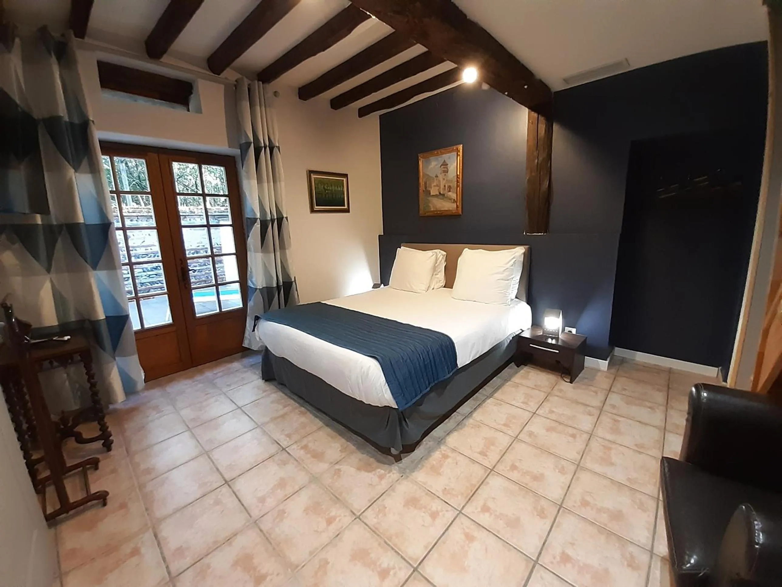 Photo of the whole room, Bed in Logis Domaine de Peyrolade
