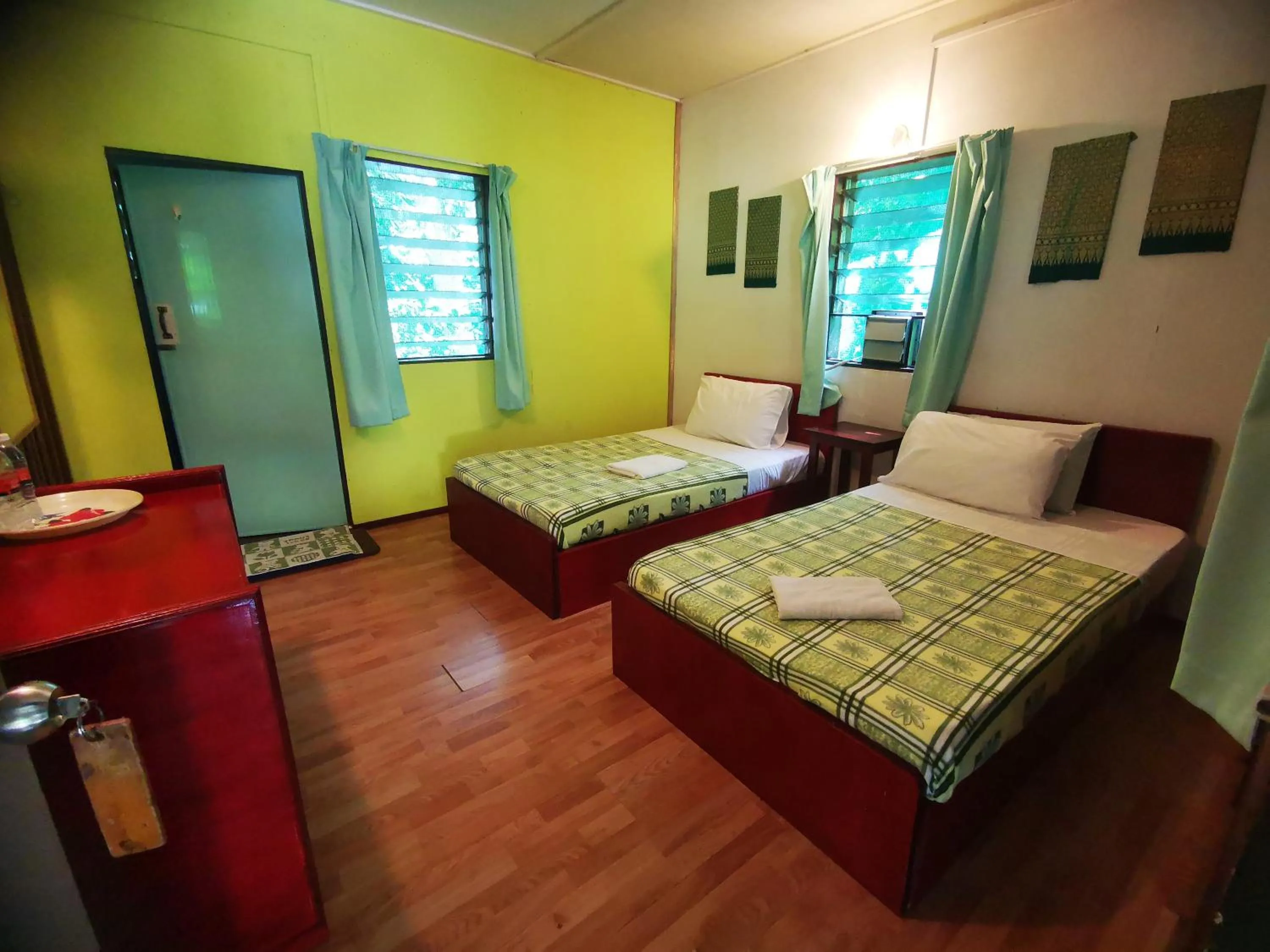 Bed in Sepilok Jungle Resort