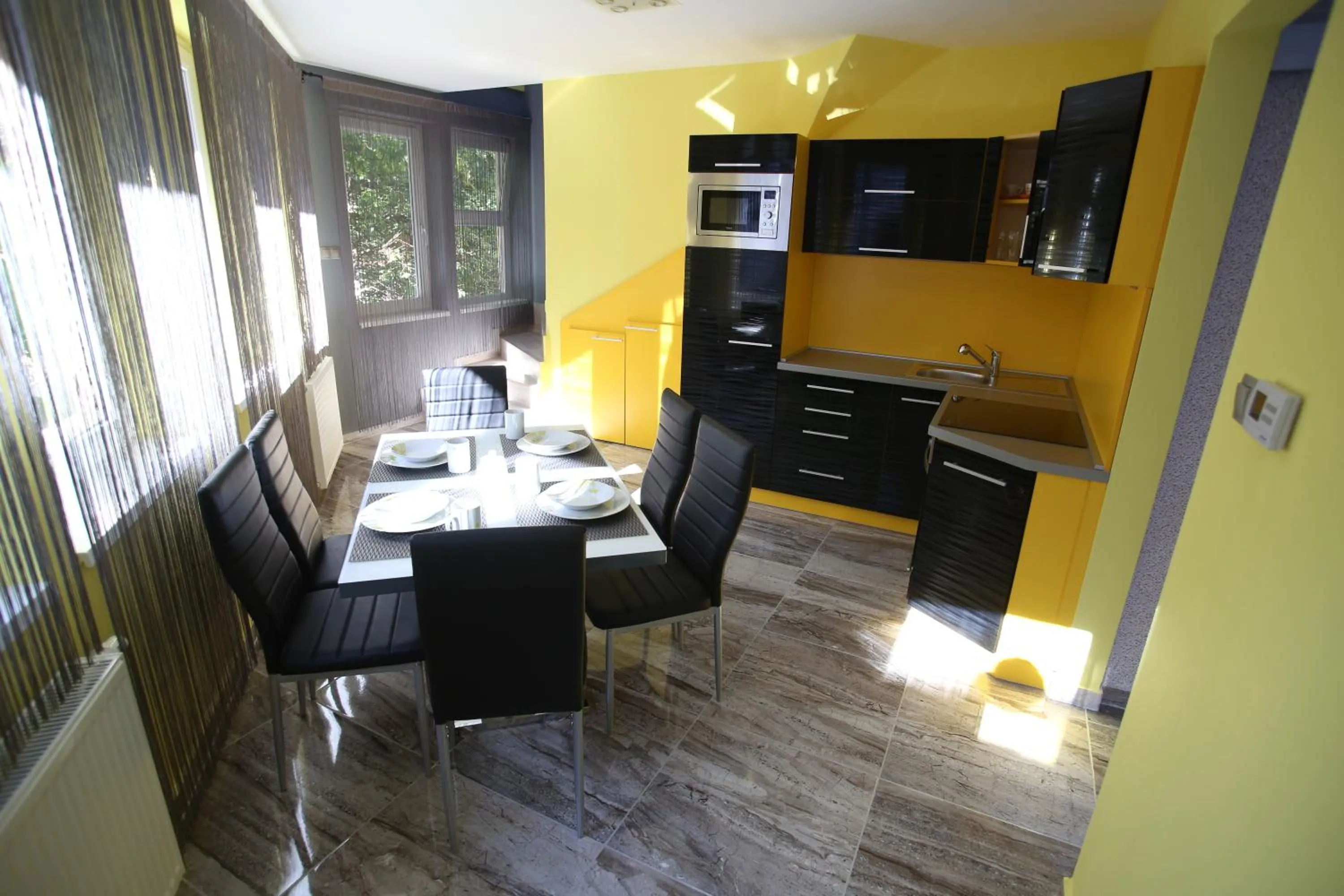 Kitchen or kitchenette in Centrum Lux Apartman